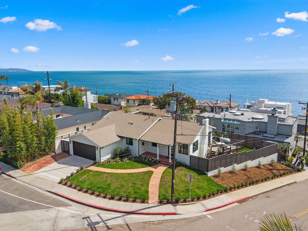 Coastal Modern Cottage with Whitewater Ocean Views! Perched on a prime corner lot just steps from the shoreline, this single-level coastal beauty offers stunning whitewater views of the iconic South Bird Surf Break. The ocean view is visible from the living room, dining area, kitchen, bedrooms, and multiple patios. Recently and extensively remodeled with permits and elevated with many modern touches, this home seamlessly blends comfort, style, and the ultimate beach lifestyle. Soak up the sun and sea breeze while enjoying effortless access to all that Bird Rock has to offer like charming cafés, boutique shopping, local markets, and an impressive mix of dining options ranging from laid-back eats to Michelin-rated cuisine. Whether you're entertaining loved ones or savoring a quiet moment with the ocean as your backdrop, this inviting retreat is a rare opportunity to live where others vacation. Please see the supplement for a full list of interior and exterior upgrades. Originally built in 1953 | Extensively remodeled in 2025 Extensively Remodeled with Exceptional Quality and Style! This home has been thoughtfully designed and remolded with permits from the inside out with high-end materials and meticulous attention to detail. Nearly every aspect has been renewed for modern comfort, efficiency, and style: Interior Rebuild: All original interior drywalls of walls and ceilings were removed and replaced with new, along with brand new insulation for improved comfort and efficiency. High quality paint throughout. Electrical System: Complete rewiring throughout the home, brand new light fixtures, and a fully upgraded electrical panel. Plumbing: All new plumbing lines and fixtures, including replacing the cast iron drains with the new drain lines all the way to the main drain. HVAC: New ducting system and thermostat, plus an energy-efficient tankless water heater. Bathrooms: Two stunning new bathrooms featuring elegant Brazilian tile, frameless glass shower enclosures, stylish vanities, and premium fixtures. Kitchen: A designer kitchen with all-new cabinetry, sleek countertops, a waterfall island, and brand new energy efficient appliances. Flooring & Millwork: Wide LVP plank flooring throughout, paired with new wood baseboards for a clean, contemporary finish. Doors & Windows: New interior doors, a striking new front entry door, new sliding glass doors, and new windows throughout the home. Storage & Closets: Custom California Closets offer smart, stylish storage solutions. Garage: Fully remodeled garage with new drywall, finished flooring surface, and a new garage door with modern equipment. Exterior Upgrades: Freshly painted, with new rain gutters, new fence and gate, yard drainage system, lush landscaping and irrigation, and low-voltage landscape lighting.