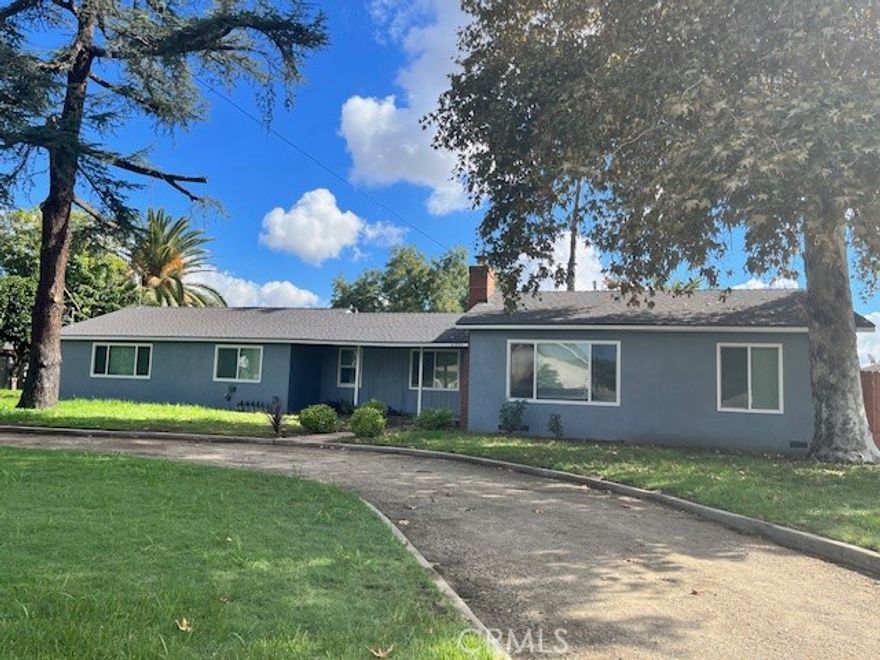 A place to call HOME. This beautifully remodeled residence features new flooring, fresh interior paint, and a brand new kitchen. The spacious living room is filled with natural light from windows overlooking the front yard. It offers three comfortable bedrooms and two renovated bathrooms. Additional highlights include two cars-garage providing extra space and a convenient laundry facility. The side yard is lined with fruit trees. Located just a short distance from schools and nearby local park. This home combines comfort, convenience and livability.