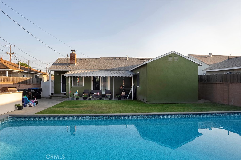 Welcome to this beautiful 3-bedroom - 1-bath home situated in a quite area in the beautiful city of Norwalk...perfect for comfort and relaxation. Enjoy a dip in the SPARKLING POOL on hot summer days and a spacious patio with built a in BBQ pit for entertaining. Inside you'll find a bright layout featuring central air and heat, a convenient laundry area and a walk-in closet for extra storage. After entertaining outdoors seamlessly transition from the well-manicured backyard and spend your evening in the living room area anchored by a brick fireplace. While the kitchen comes equipped with appliances included. The attached garage offers direct access into the home. ROOF replaced in 2022, inside newly painted and plumbing has copper piping. The property combines indoor comfort and a warm atmosphere with outdoor enjoyment and entertainment. This home is an excellent opportunity for buyers seeking both relaxation and functionality. Make this your home to create lasting memories! This home is close to Cerritos Mall, New River Park, AMC Norwalk 20 Movie Theatre, Golf N Stuff, schools, and easy freeway access.