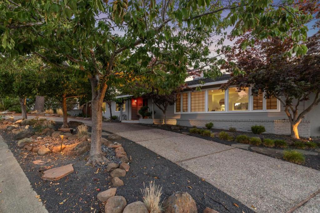 Nestled on a quiet cul de sac in the Laurel Creek Farm neighborhood, this single-story residence offers 2,266sqft of thoughtfully updated living space. A circular driveway leads to the welcoming entry. Inside, open floor plan, vaulted ceiling and large windows create light filled gathering spaces that flow effortlessly between the living room, dining area and family kitchen. Enjoy breathtaking views of San Mateo Hills from your private retreat. The backyard is designed for tranquility with lush Japanese inspired garden, complete with pathways and private sitting areas, creating perfect space for relaxation and entertaining. The home has been extensively updated. Remodeled kitchen and bathrooms, new windows, new roof and heating system enhance comfort and efficiency. Owned solar panels paired with a Tesla battery provide sustainable power and peace of mind, while the open layout and single level plan make day to day living effortless.