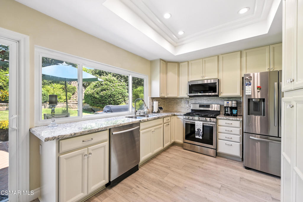 Step inside this charming single-story home where comfort meets convenience. With four bedrooms and two baths, this move-in-ready gem offers a thoughtfully remodeled kitchen, gleaming luxury vinyl plank flooring, and abundant natural light throughout.Out back, a pool-size yard with colorful flowers and several fruit trees offers endless possibilities -- from building your dream garden to adding an ADU for extra living space. The front patio is the perfect spot to sip your morning coffee or unwind after a long day, while the spacious backyard invites weekend barbecues, family gatherings, and quiet evenings under the stars.Enjoy the peace of a great neighborhood paired with the ease of quick freeway access, nearby shopping, parks, and award-winning schools. Recent upgrades, including a five-year roof and enhanced air conditioning with new ducting, mean you can focus on making memories, not maintenance. This isn't just a house -- it's the lifestyle you've been dreaming of.