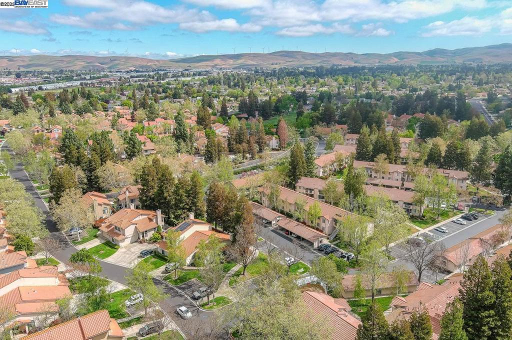 Welcome to 4667 Laurie Common, a darling second-floor condo tucked into one of Livermore’s most charming communities. This updated 2-bedroom, 2-bath residence offers the perfect blend of style and functionality, with rich engineered wood floors, crisp white cabinetry, gleaming granite countertops, and stainless steel appliances creating a fresh, modern feel throughout. Natural light pours in through large windows, highlighting the open layout and inviting ambiance. The living room flows effortlessly to a spacious patio—your own private escape to sip morning coffee or unwind with a glass of wine at the end of the day. Both bathrooms have been thoughtfully updated with a clean, contemporary touch, and every inch of the home has been lovingly maintained. Whether you're hosting a casual gathering or enjoying a quiet night in, this home lives larger than its square footage suggests. All of this nestled just moments from top-rated schools, vibrant downtown Livermore, wineries, trails, and local favorites for dining and shopping.
