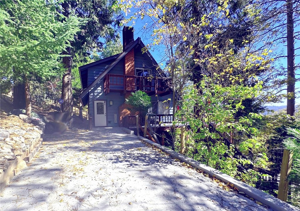 Welcome to Your Lake Arrowhead Mountain Retreat!  Experience mountain living at its best in this beautiful home with lake rights! Featuring a dual entrance with level entry from the access road and additional parking off Bernina—a county-plowed and maintained road—this property offers year-round convenience and plenty of parking.  Step inside to an inviting open-concept layout with a spacious living room, dining area, and kitchen—perfect for entertaining and relaxing. The living room features an impressive stone fireplace, beamed tongue-and-groove ceilings, and warm wood flooring that give the home a true mountain-lodge feel.  The main level includes a bedroom and full bath, ideal for guests or single-level living. Upstairs, you’ll find two large bedrooms with vaulted ceilings and a full bathroom.  Enjoy outdoor living on the oversized deck surrounded by serene tree views—perfect for gatherings, barbecues, or quiet mornings with coffee. The fenced yard adds extra privacy.  Additional highlights include a new mini-split AC system for year-round comfort.  Whether you’re looking for a full-time mountain home or a peaceful getaway with lake access, this home offers the perfect blend of charm, functionality, and location.
