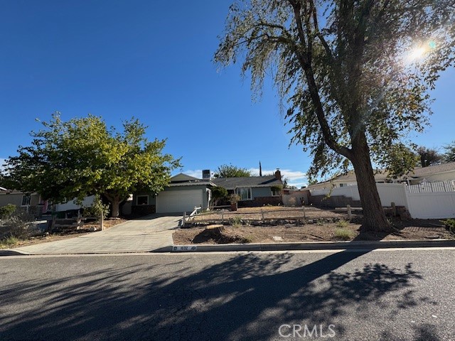 Welcome home to this beautifully maintained 3-bedroom, 2-bath home offering 1,334 sq. ft. of living space on a 0.16-acre lot. Built in 1955, this Lancaster classic combines timeless charm with modern comfort. Enjoy a bright, open living room with large windows and a cozy wood/gas-burning fireplace, an updated kitchen with plenty of cabinets and a breakfast area, and three spacious bedrooms with two bathrooms. The large bonus room offers endless possibilities—use it as a home office, gym, playroom, or entertainment space. Outside, the spacious backyard is perfect for BBQs, gardening, or relaxing under the desert sky. This home also features an attached garage, ample storage throughout, and central heating and air for year-round comfort. Located in a quiet, established neighborhood close to shopping, great schools, and freeway-friendly for commuters, everything you need is just minutes away. Don’t miss your chance to call this charming Lancaster home yours. Perfect for first-time buyers, growing families, or investors. Lancaster living for only $399,999.
