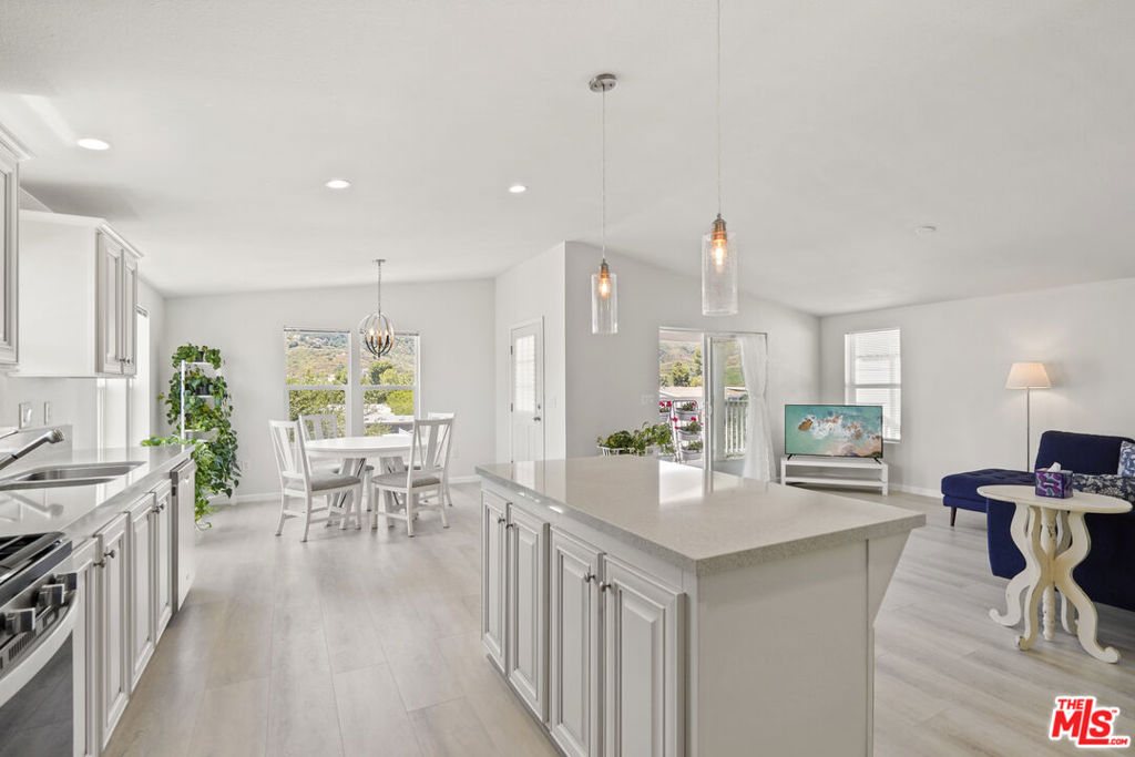 Welcome to your modern oasis in Seminole Springs. This newer 2022 home for lease offers one of the best locations in community, boasting 3 bedrooms, 2 bathrooms, and an abundance of natural light throughout. With cathedral ceilings and stunning mountain and canyon views from the living, dining, and kitchen areas, this home provides a sense of tranquility and charm. Step into the spacious living room and chef's kitchen featuring elegant quartz counters, perfect for entertaining or simply enjoying daily life. The primary bedroom offers an ensuite bathroom and a large walk-in closet, providing a private retreat within the home. Relish in the breathtaking canyon and Santa Monica Mountain views from your covered patio while sipping your morning coffee. Private backyard, and 3 car covered parking, home is situated on the top street and cul-de-sac, a rare find in this sought-after community. Embrace the beauty of nature right from the comfort of your own home. Lease available now! Seminole Springs is located only 15mins from the Malibu beaches, and 5mins from the 101 fwy, local shops and restaurants. Tenants will enjoy the amazing park amenities; year round heated pool/spa, outdoor BBQ area, fitness room, clubhouse, children's playground, billiards room, basketball court, dog park, and more! Part of the Las Virgenes School District.
