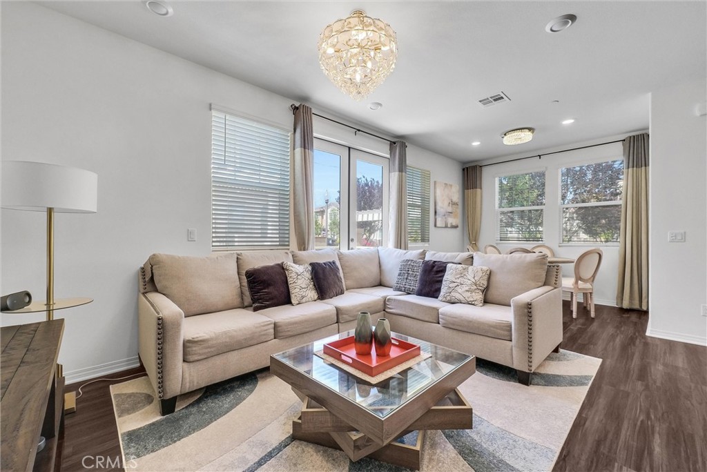 Welcome to a charming newer Townhome situated in convenient location of Chino. Preserves offers a spacious 1668 sqft the living area. Step inside to discover a thoughtfully designed interior featuring a cozy living room and A open modern Kitchen opens onto a perfect size backyard for BBQ and relaxing.  This stunning home features 3-bedroom, 2.5-bathroom, The primary suite is a true retreat, boasting a generous layout and a large walk-in closet, complete with a private bedroom, an suite bathroom and two other cozy rooms with a full bathroom and a separate walk-in laundry room. A large loft for family entertainment or home office used. attached two car garage with a built in electrical car charger.  The features including lower cost  the Lease Solar System, Buyer to assume Solar lease. Don't miss out on this one!