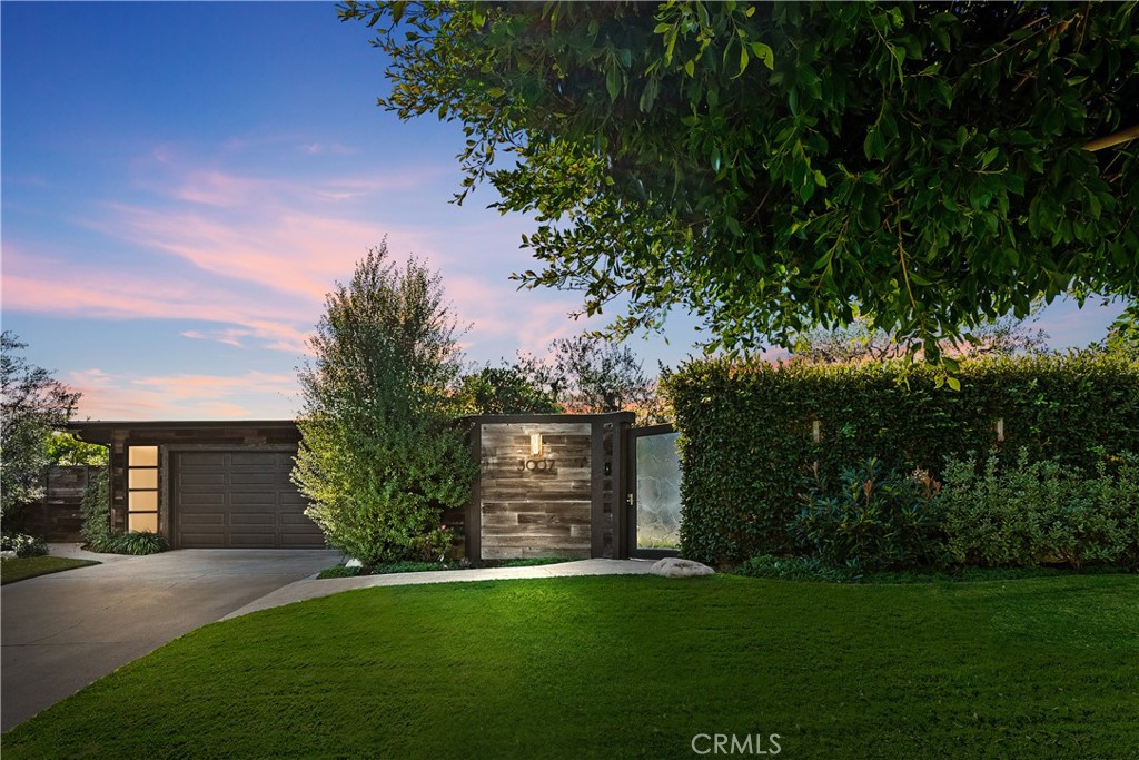 Located in the highly sought-after Harbor View Hills neighborhood of Corona del Mar, 3007 Harbor View Drive is a stunning, single-level residence offering breathtaking panoramic ocean, Catalina Island, and sunset views from nearly every room. This beautifully remodeled home features 3 bedrooms, 2.5 baths, and over 2,475 square feet of refined living space, highlighted by expansive open-concept areas, three fireplaces, custom built-ins, and floor-to-ceiling windows that flood the home with natural light. The chef’s kitchen and luxurious bathrooms have been thoughtfully updated with designer finishes, while French doors throughout create a seamless indoor-outdoor flow to a wraparound courtyard, multiple patios, and a private 13,770 sq ft lot surrounded by mature landscaping, including gorgeous olive trees. Perched on a premier end lot with only one neighbor and 270-degree views, this property offers an unmatched sense of privacy and tranquility, all just minutes from world-class dining, shopping, beaches, and top-rated schools. This is coastal living at its finest—a rare opportunity to own a remarkable view home in one of Orange County’s most prestigious communities.