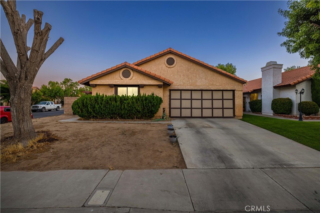Adorable home located in East Palmdale near schools, parks, shopping and DryTown Water Park. The home is situated on a corner lot. Inside you will find an open floor plan perfect for entertaining. The living room offers plenty of space. The kitchen features an island, black appliances and connection to the dining room. The dining room is spacious and connected to the kitchen perfect for entertaining. The family room features a fireplace perfect for winter. The primary retreat offers plenty of space with an attached bathroom and a closet. There is 1 additional guest bedroom and a guest bathroom. The rear yard features a covered patio and block walls surrounding. This home is a MUST see!