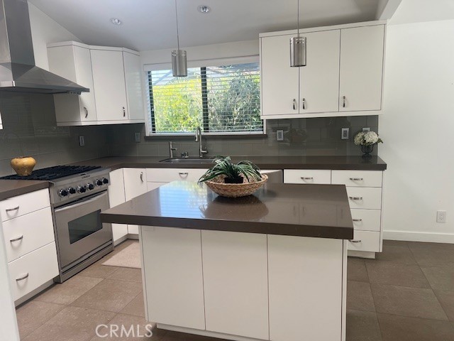 Single level Plan “5” beautiful townhome in a desirable Golf Course location. This home has been totally remodeled with modern flair. Upgraded appliances includes washer and dryer. The open kitchen has an Island and a Breakfast Nook to enjoy your morning coffee while looking out at tree views. Both Bathrooms totally remodeled. Large open living room with lots of light and windows to see Panoramic golf course views. Nice size patio to sit and enjoy the scenery. Vacant and ready for occupancy. Short walk to Manhattan Village Mall with shopping and Restaurants. Private Tennis Club also a short walk to. Property backs up to a Public Golf Course also a short walk to enter. Walking paths throughout the Village. Guard Gated private entrance for security.