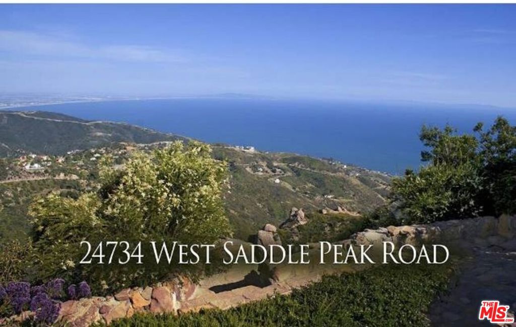 Spectacular 1.9-acre Malibu Burnout Lot with Panoramic Ocean Views. This exceptional property offers World class, sweeping Pacific views, city lights from downtown L.A. to Palos Verde (known as the Queen's Necklace), whitewater views of the coastline, Catalina and the Channel Islands, snow covered peaks near Big Bear and over Palos Verde to Long Beach. Best views in Malibu. Its breathtaking! The property was previously home to a stunning residence designed by world-renowned architect Doug Burdge. Doug is ready to work with the new buyer to recreate his masterpiece or build your dream home at a substantial savings over starting from scratch. Situated in a drop dead gorgeous, gated community in the West Saddle Peak area just minutes from PCH and Malibu Canyon, the lot offers both seclusion and convenience, with direct access to some of Malibu's best hiking trails right from your doorstep. Additionally, the property may allow for placement of a trailer or ADU during the building process, offering usability while your dream home takes shape.Beyond the magnificent views, this property offers a distinct advantage as it's a burnout lot located on a ridgeline of Saddle Peak Mountain, meaning it was previously developed (i.e. grandfathered into ridgeline reconstruction to fully exploit the stunning vistas) and retains valuable infrastructure. Existing amenities include the septic system, mature landscaping with gorgeous natural rock walkways, patios, lawn, driveway, and best of all, much of the engineer inspected foundation remains intact. Burnout lots, due to their previous development, qualify for an expedited building permit process. This significantly reduces the typical timeframe and difficulty associated with obtaining permits in Malibu, potentially shortening the process by years. This allows for quicker construction and the ability to personalize the home with desired finishes in a fraction of the usual time. Investing in a burnout lot offers the potential for significant appreciation as the neighborhood rebuilds with modern, state-of-the-art homes, replacing the original, older homes. With its world-class views, prestigious gated setting, streamlined construction potential, and opportunity for significant appreciation as the neighborhood rebuilds with modern luxury estates, this property represents a rare and highly desirable offering in Malibu real estate.