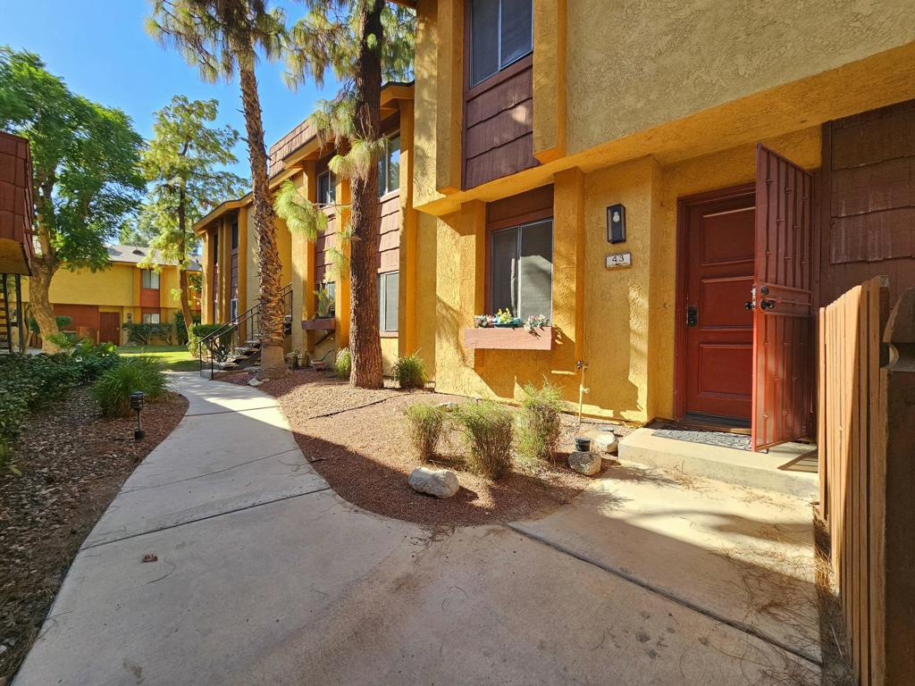 **Charming (2) story Loft Model condo located in an excellent location within QLRC. Patio offers a wonderful view of the peaceful meandering stream that flows through this delightful community. Living room has a feeling of spaciousness because of the high ceiling opening to the loft. The sleeping area is upstairs with full bath + dressing area & (2) closets. There is a 1/2 bath downstairs. Galley kitchen has newer dishwasher, gas stove & microwave. Cabinets have been painted white and the counters are tile. There is a serving/eating counter between kitchen & dining area. Newer flooring has been installed. Washer & Dryer are within closet on patio. There is a SINGLE GARAGE w/remote. Private, portable, propane Bar-B-Q on patio. QLRC has (2) lighted tennis courts, large pool and spa. ***Indian Palms C.C. is across Monroe Street...27 Holes Golf + Restaurant.
