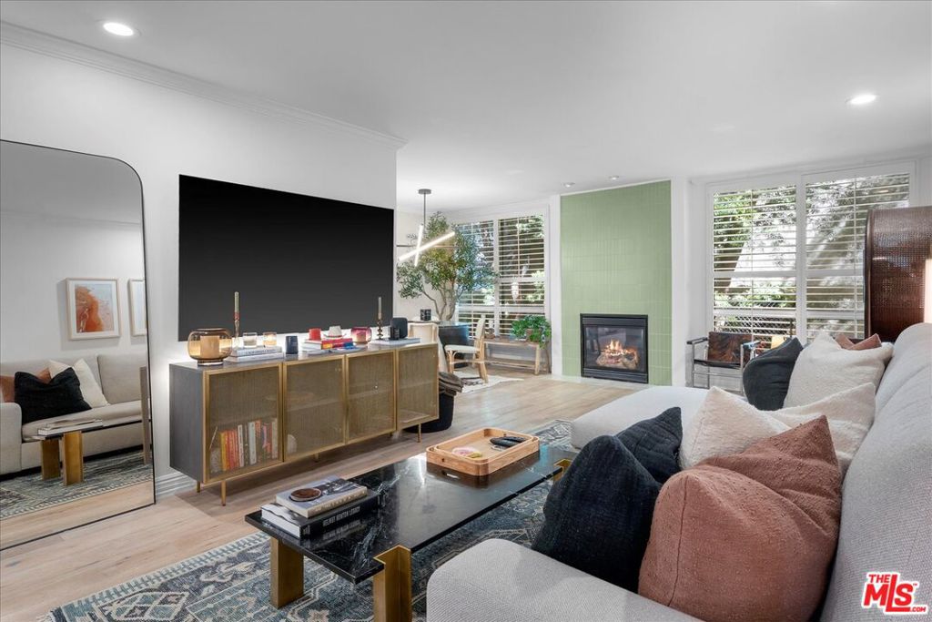 Experience elevated West Hollywood living in this impeccably remodeled residence on sought-after Kings Road. This sophisticated one-bedroom condo features hand-scraped hardwood floors, crisp white walls, plantation shutters, and a light-filled open layout. The chef's kitchen is equipped with high-end appliances, white subway tile, and striking black countertops, seamlessly connecting to a stylish dining area. The spacious living room is anchored by a gas fireplace with a newly tiled wall, creating a warm, designer ambiance. The freshly updated bathroom showcases luxe finishes, while the tranquil bedroom offers a walk-in closet and abundant storage. Located in a secure, pet-friendly building with a sundeck and sparkling pool, just moments from West Hollywood's premier dining, shopping, and nightlife. HOA includes earthquake insurance, gas, and basic cable - this is turnkey Westside luxury at its finest. Also available for purchase for $695,000.