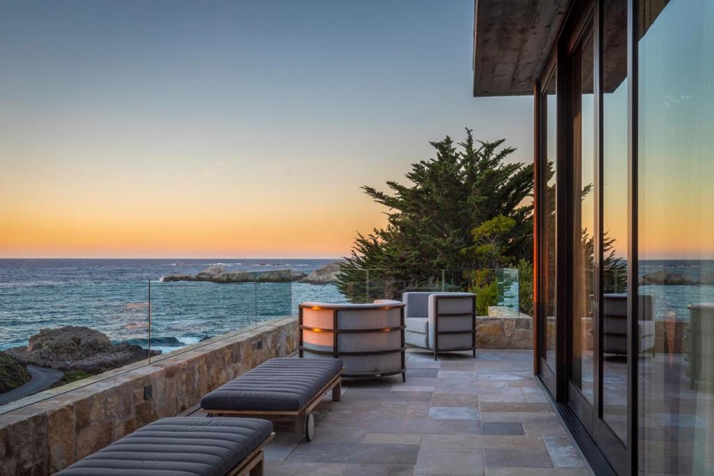 Just mins south of downtown Carmel, along scenic Highway 1, discover a spectacular architectural statement designed by Studio Schicketanz. With northern ocean views & sunny southern exposure, the cantilevered living spaces were designed to maximize views & capture natural light within the home. A state-of-the-art kitchen features Boffi cabinetry, Mugnaini wood-fire pizza oven & reclaimed stonework to organically unify the entire home. Designed as the ideal family home as well as host guests on their own level with an elevator between the 4 car garage & main floor. The master suite features floor to ceiling glass doors, a private office, expansive closet, & spa like bath to relax in luxury. The indoors flow seamlessly to the outdoor spaces for exceptional entertaining with the stunning backdrop of the CA Coastline. Enjoy the putting green, infinity pool & hot tub, or gather the family around the fire to roast marshmallows. Every day becomes a celebration to cherish here, at Lobos Views.