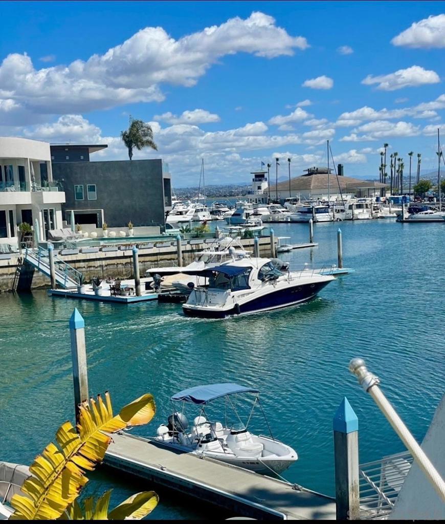 Waterfront Condo with BOAT DOCK in Prestigious Coronado Cays Marina Community. 2BR/2BA, MW, SS appliances, wine refrigerator, W/D, BBQ on deck over looking 35' boat slip. Just bring your suitcase and water toys. 2 car garage, community pool and pickle ball / tennis courts close by. Power and Sailboating, kayaking, kite boarding, paddle boarding, swimming, surfing and fishing for your aquatic pleasure. Silver Strand State Beach a short walk away. Loew's Resort nearby provides dining, boat rentals, 3 pools and day spa.