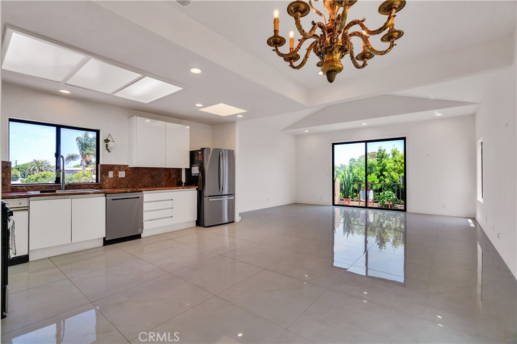 Welcome to this beautifully reimagined residence in the heart of Redondo Beach, where style, space, and sophistication blend effortlessly. The home offers an elevated living experience with 3 spacious bedrooms and 3.5 updated bathrooms, all set within a bright and airy open-concept layout.
Step inside to discover gleaming oversized tile floors, vaulted ceilings, and an abundance of natural light. The expansive kitchen features sleek white cabinetry, granite slab countertops and backsplash, and stainless steel appliances, perfect for both casual dining and entertaining.
The bathrooms are nothing short of luxury, with thoughtful designer finishes throughout. Enjoy the convenience of indoor-outdoor living with a balcony and easy access to the yard, ideal for hosting gatherings or relaxing in the fresh air. The home's flexible layout offers multiple lounge areas, perfect for modern families or working professionals seeking comfortable separation of space.
Located in a quiet, friendly neighborhood just minutes from Redondo’s award-winning schools, beaches, and shopping, this turnkey home is the perfect blend of contemporary comfort and South Bay charm.