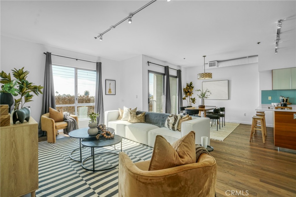 Rare Studio offered at highly desirable and well maintained T-Lofts in the popular Sawtelle neighborhood of West LA! This 3rd floor unit has South facing oversized windows for year around natural lighting, high ceilings, central AC/ heat, full-sized washer and dryer in unit. The bedroom area features custom sliding door panels and dual sided built in closets. The full bathroom has double-sink vanity and separate tiled tub, shower, and toilet room. The modern kitchen has soft-close cabinetry, Caesarstone countertops, as well as a 4-seat eating bar. Stainless steel appliances that include a gas range/oven, dishwasher, refrigerator, microwave, and deep-bowl sink with faucet sprayer. Amenities include two assigned tandem parking spaces in a gated parking garage, bike racks, electric car charging stations, secure guest parking, an outdoor spa with shower and restrooms, BBQ area, picnic area, gym, conference room, two elevators, package lockers, a eco-friendly landscaped courtyard, and secured entry with controlled access, surveillance, callbox, and an open-air lobby with a lounge area. HOA monthly dues cover water, gas, trash, sewer, and common areas.