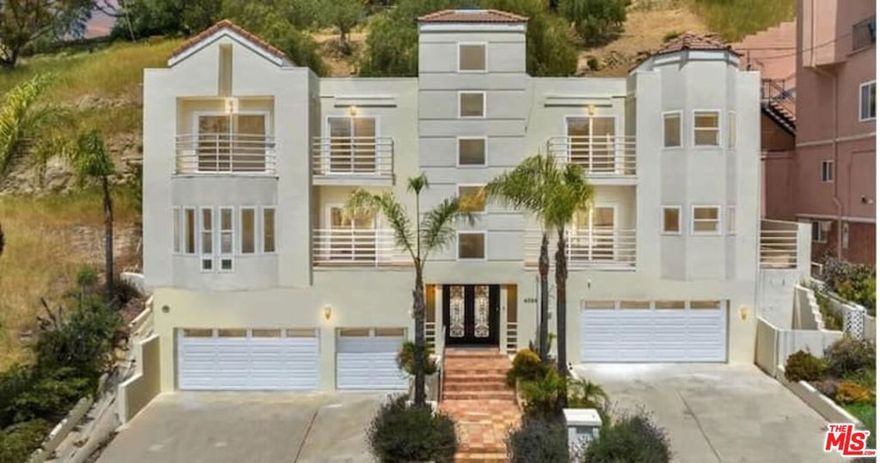 Are you searching for a furnished home that has multiple garages with room to park 5 cars? Welcome to your Mediterranean-style split-level home situated in "Prime" South of the Boulevard Woodland Hills. This is NOT a duplex or multiple family home...its a gorgeous SINGLE FAMILY Mediterranean style home! Showcasing gorgeous views of the surrounding hills, this gem boasts a spacious and elegant interior that is perfect for both entertaining guests and relaxing with family. With three large bedrooms and four bathrooms spread out over 2,881 square feet of living space, this home has everything you need for comfortable and luxurious living. Beautifully remodeled open-style kitchen boasting high end LG stainless steel appliances, quartz counters and island open to the living room complete with a cozy fireplace that is perfect for chilly evenings. Your formal dining room is spacious and inviting, offering plenty of room for hosting large dinner parties and other gatherings. The large family room is another highlight of this home offering ample space for relaxing and spending time with loved ones. Your master suite is a retreat complete with an en suite bathroom, fireplace, balcony and two walk-in closets that provide plenty of storage space. Two additional guest bedrooms, each with an en suite bathroom, offer plenty of room for visitors, while the multiple garages provide ample parking space for up to five cars. This home's outdoor spaces are equally impressive, with multiple balconies that offer stunning views of the surrounding hills and valleys. The private rear patio is the perfect place to unwind and soak up the sun, with its large planter, custom mosaic and outdoor BBQ that are perfect for entertaining. Other notable features include recessed lights, a custom iron/glass front door, central HVAC and heat and 3 fireplaces. With its amazing views and luxurious amenities, this home is the perfect choice for anyone looking for the ultimate in Mediterranean-style living in the heart of Woodland Hills. Conveniently situated close to good schools, great shopping, amazing restaurants, Woodland Hills Country Club, Trader Joes, The Village, Warner Center, quick easy access to the 101, Ventura Blvd and is a short 30 min drive down Topanga Canyon to the beach!