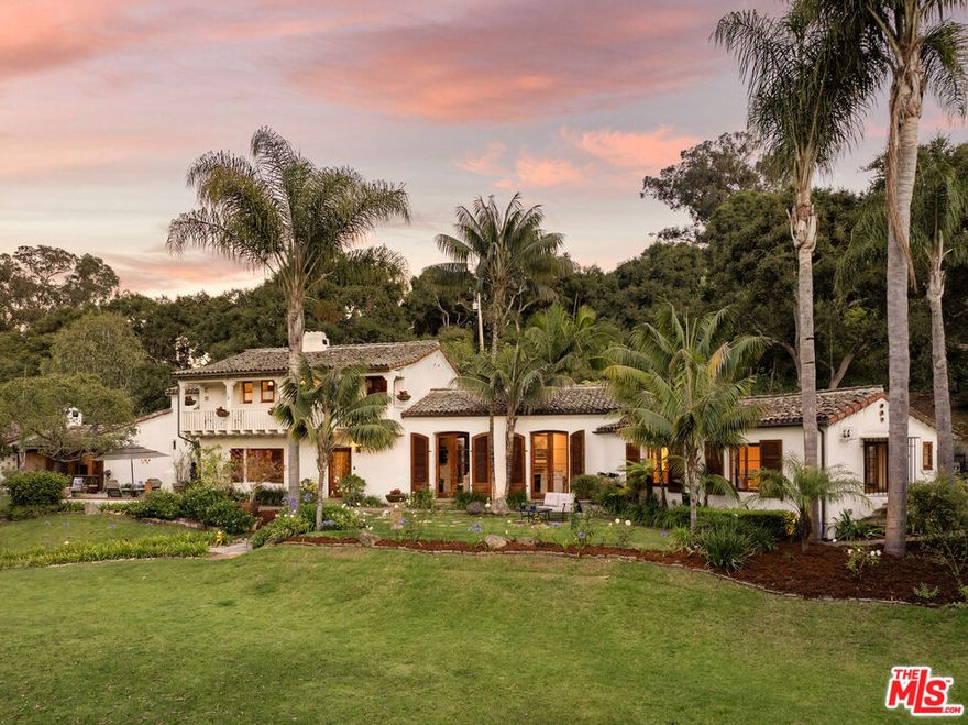 Discover a rare opportunity to own a pedigree property in the prestigious Hope Ranch, featuring a stunning 5-bedroom, 7-bath Plunkett home set on 1.65 acres with breathtaking views of the lake, golf course, and mountains. Designed by renowned Santa Barbara architect Joseph Plunkett, this estate, built in 1927 and thoughtfully remodeled, offers a seamless blend of timeless elegance and modern comfort, capturing the essence of full-time resort living or a luxurious second-home retreat. As you arrive at this grand residence, the formal entry warmly welcomes you, with doors opening to both the front and back terraces. Inside, elegant hardwood floors grace the home, exuding timeless beauty. Abundant natural light floods the interiors through numerous doors leading to lush gardens and anoasis-like pool, complete with a slide, fire fountains, a waterfall, a Jacuzzi, and an outdoor sauna. The expansive lawns, framed by majestic oak trees and a range of succulents and fruit trees, provide a perfect setting for relaxation and entertaining. A charming well under the oaks and stone walls adds a touch of whimsy, ideal for hosting parties.The formal living room features vaulted ceilings and a striking fireplace, with French doors that open to both the front and backyard, enhancing the indoor-outdoor living experience. The formal dining room offers panoramic lake views, creating an intimate setting for gatherings. The bright, sunny kitchen boasts large glass skylights and modern upgrades. A spacious island serves as a welcoming centerpiece, inviting guests to gather. Disappearing doors seamlessly connect to the backyard and pool area, where an outdoor fireplace and patio offer an ideal space for alfresco dining. The backyard also features a romantic, ivy-covered pergola with lights, providing an enchanting setting for intimate events or dinner parties.The upstairs primary suite is a private retreat with a large deck offering serene views of the golf course, lake, and mountains. This suite also includes another fireplace, a built-in reading nook, and a cathedral ceiling. The suite's private balcony and additional bedroom options create opportunities for customization, such as a nursery, separate sitting room, or a luxurious his-and-her closet. The bedrooms throughout the home evoke the ambiance of a boutique hotel, combining elegance with unparalleled comfort. The upstairs guest suite, with its spacious deck, is perfect for hosting visitors.For those who prefer ground-level living, there is a spacious alternative primary suite on the lower level, complete with a fireplace and captivating views of the lake and beyond. This west wing suite offers immediate access to the pool and sauna, combining convenience and luxury.The east wing of the home includes a versatile 4th bedroom or yoga room with private access and the soothing sounds of the fountain, a full bath, an office with stunning views of nature, and a large mudroom. The 5th bedroom, with its own entrance and sitting room, features a remodeled bathroom and a wet bar with a fridge, offering a cozy space for relaxation, a live-in caretaker, longer-term guests, teenagers, or extended family.Additional features include a solar system for energy efficiency and a two-car garage, enhancing the property's functionality. This estate presents a unique opportunity to own a distinguished property designed by a well-known Santa Barbara architect that effortlessly blends luxurious living spaces with outstanding outdoor amenities, offering a true sanctuary in Hope Ranch. Whether for full-time elegance or a charming second-home getaway, the possibilities for entertaining friends and family are limitless in this exquisite property. Hope Ranch Community ~ Hope Ranch is an exclusive, picturesque community known for its sprawling estates and unparalleled natural beauty. Nestled along the stunning Santa Barbara coastline, it offers residents access to private beaches, equestrian trails & tennis courts.