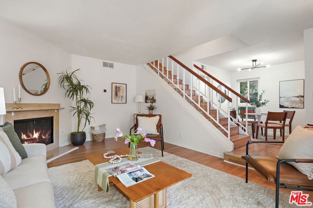 This 3-bedroom, 2.5-bathroom end-unit townhome in Tarzana stands out from the crowd. Set within a secure, beautifully landscaped community, it blends comfort, style, and unbeatable convenience. Step inside to an inviting living room with a cozy fireplace, flowing seamlessly into the dining area and kitchen ideal for casual meals or entertaining friends. Upstairs, the spacious primary suite features a walk-in closet and private en-suite bath. The second and third bedrooms are generously sized with, walk-in closets and easy access to a full bathroom nearby. Unlike most units, this townhome has an attached side-by-side 2-car garage with direct access no hauling groceries across parking lots. No stairs from the garage to the main living area makes daily life that much easier. Even better, unit includes a full-sized washer and dryer , so you can skip common laundry room altogether. Visitors will appreciate the private gate and foyer entry directly from Hatteras Street, sparing them a trek through the complex to find your door. When it's time to relax, enjoy resort-style amenities including a pool, spa, gym, sauna, basketball court, and club house all surrounded by manicured grounds that create a serene setting. And the location? Right in the heart of Tarzana, minutes from Providence Cedars-Sinai Tarzana Medical Center, Pierce College, CSUN, Westfield Topanga, Topanga Social, Lake Balboa, and not one but two Trader Joe's stores. This is the perfect blend of lifestyle, location, and everyday ease.