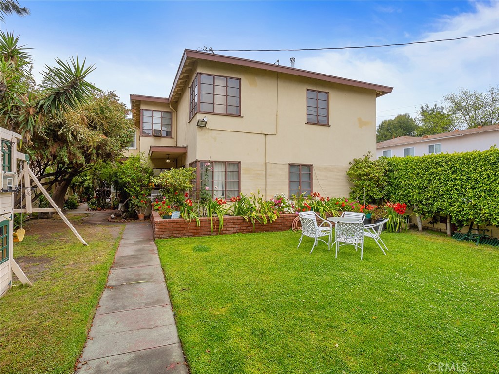 This exceptional property is a rare find, offering 3,626 square feet of living space on a large 7,810 square foot lot. The building consists of four townhouse-style units, each with two bedrooms and one bathroom, providing ample space and comfort for tenants or owner-occupants. Every unit features beautiful hardwood floors throughout, creating a warm and inviting atmosphere. The formal dining room in each unit offers an elegant space for meals and gatherings, while large windows bring in plenty of natural light, making the units feel bright and open. The units also boast a large front yard, ideal for outdoor relaxation or gardening. For added convenience, there is a shared laundry room with additional storage space, as well as a patio and separate storage area for each unit. The property offers plenty of parking, with a four-car carport, one-car garage, and five off-street parking spaces available. The owner’s unit is move-in ready, making it perfect for an investor or anyone seeking to live on-site while managing the property. This is an incredible opportunity to acquire a turn-key building in a prime location, offering both charm and income potential.
