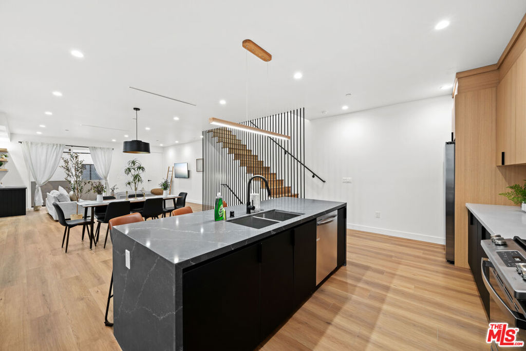 Stunning 4-Bedroom Townhome with 4 En-Suite Bathrooms, Powder Room & Private 2-Car Garage! This brand-new modern construction offers the perfect blend of luxury, space, and functionality - featuring four generously sized bedrooms, each with its own en-suite bathroom, plus an additional powder room for guests. Located just moments from Larchmont Village and Hancock Park, the residence boasts a spacious open floor plan flooded with natural light, creating a seamless flow between the living, dining, and kitchen areas - ideal for both entertaining and everyday living. Additional highlights include soaring ceilings, designer finishes, in-unit laundry, a private balcony, and a secluded outdoor area perfect for relaxing or hosting. A private two-car garage offers secure and convenient parking. Set in the heart of Hollywood, you'll be surrounded by iconic landmarks, historic theaters, and a dynamic mix of restaurants, cafes, and nightlife. Enjoy the best of modern design and urban living in one of L.A.'s most vibrant neighborhoods.