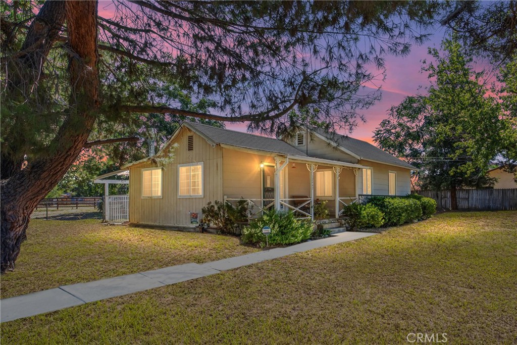 This cozy, well-loved 2 bedroom, 2 bathroom home sits on just under an acre of horse property in Yucaipa’s desirable Dunlap Acres neighborhood. Enjoy stunning mountain views, open beam ceilings with a wood stove in the living room, and a comfortable kitchen with granite countertops. Ceiling fans, and a rooftop A/C and heat unit keep the home comfortable year-round.
The property offers endless potential with a detached two-car garage, utility shed, covered front and back porches, and a single covered horse stall. Mature pine, sequoia, and Trees of Heaven provide shade and natural beauty, while the large backyard is perfect for pets or entertaining.
This location is hard to beat—close to Oak Glen, local schools, new shopping and dining options, and freeway access. Just a short drive brings you to Yucaipa’s farmers markets, art events, and the Performing Arts Center, along with favorite coffee spots like Starbucks and Dutch Bros, and a new Trader Joe’s. Move in and enjoy it as-is, or customize and make it your own—this special property is ready for its next chapter.