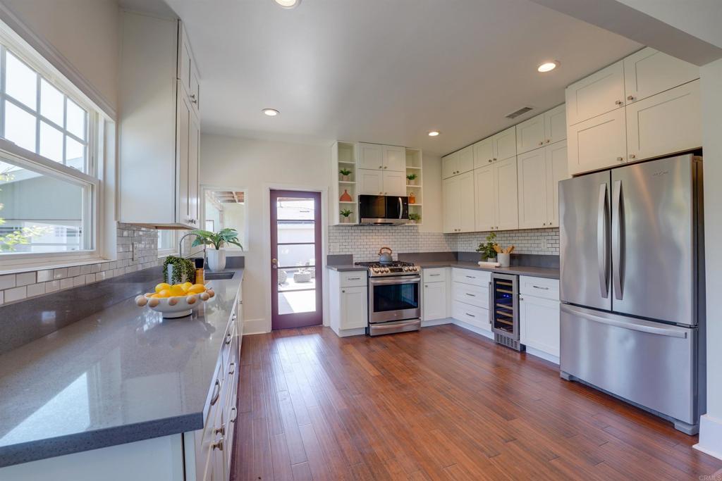 Turn-key; 2-on-1 property in Normal Heights is perfect for multi-generational living or income-producing investment. LIVE IN ONE AND RENT THE OTHER OR RENT BOTH, or create the ideal setup for extended family—this property offers flexibility and value in one of San Diego’s most sought-after neighborhoods. North of Adams Avenue, in the heart of Normal Heights, this unique offering features a charming 1927 Craftsman home and a MODERN DETACHED ADU BUILT IN 2022, each with owned solar systems, private outdoor space, and separate parking. The front home is a classic 2-bedroom, 2-bath Craftsman, thoughtfully renovated to blend timeless character with modern updates. Improvements include a new roof, dual-pane windows, updated electrical and sewer lines, refreshed kitchen and baths, fresh interior and exterior paint, a newly poured garage slab, and professional landscaping. A new driveway and patio enhance curb appeal and functionality. The rear unit is a spacious, detached 2-bedroom, 2-bath ADU with alley access, its own private driveway, and a dedicated entrance—offering complete privacy and convenience. With 856 sq. ft. of living space, this light-filled home features an open-concept design, a private patio, and parking for two. Additional highlights include a large 460 sq. ft. detached two-car garage with potential for conversion (buyer to verify), and a detached shed ideal for a home office or creative space. The extra-wide driveway is a rare find in this neighborhood and adds exceptional value. Walk to coffee shops, restaurants, yoga studios, live music venues, and all the energy of Adams Avenue. This is a rare opportunity to own a two-on-one-lot gem in 92116—ideal as a primary residence, multigenerational setup, or a premium rental investment.