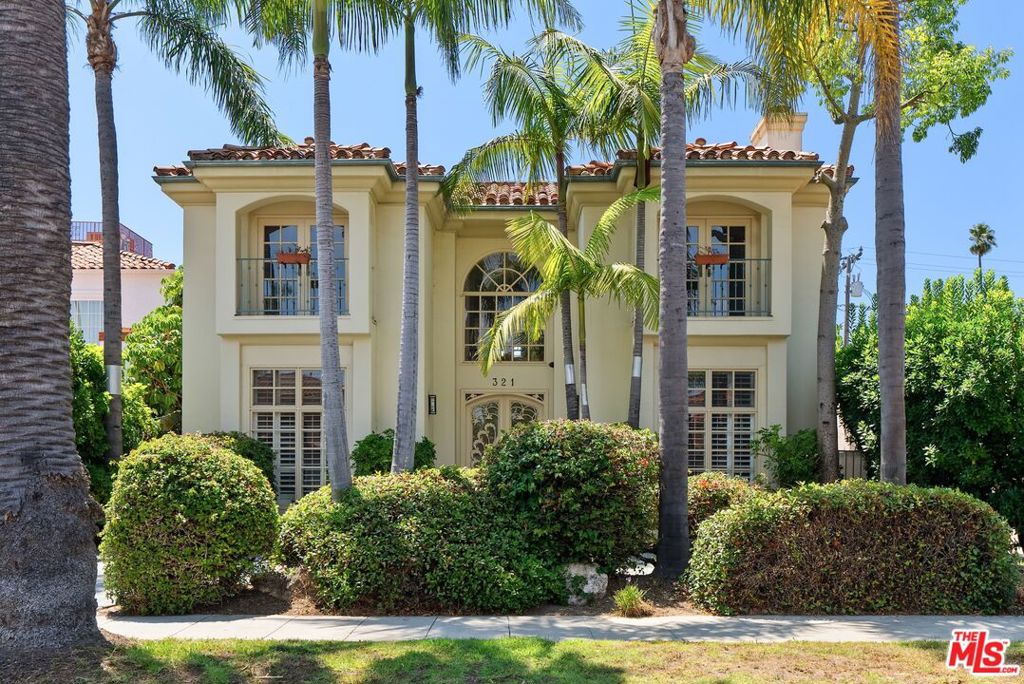 Located in the coveted Beverly Hills neighborhood, this elegant Contemporary Mediterranean offers over 4,500 square feet of refined living. With 4 bedrooms and 4.5 bathrooms, the home features soaring ceilings, rich wood floors, and multiple fireplaces, creating a warm and sophisticated atmosphere.Step into the dramatic double-height entry, where etched-glass double doors and a grand chandelier set the tone. The formal living and dining rooms flow into an airy family room with a timeless fireplace, custom built-ins, and French doors that lead to a covered patio and grassy backyard. The expansive chef's kitchen features granite countertops, a center island, and generous storage, ideal for both entertaining and everyday living. Completing the main level is a versatile bedroom with its own bathroom, ideal as a home office, guest room, or creative retreat, offering flexibility to suit your lifestyle.A sweeping staircase leads to the upper level, where you'll find three additional bedrooms - including two generous guest suites, each with its own en-suite bathroom and walk-in closet, and a luxurious primary suite featuring a private balcony, fireplace, dual his-and-hers closets, and a spa-like bathroom with a soaking tub and glass-enclosed shower.Additional highlights include a sizable carport, dedicated laundry room, and abundant storage throughout, all just minutes from top-rated schools, world-class dining, luxury shopping, and everything Beverly Hills has to offer.