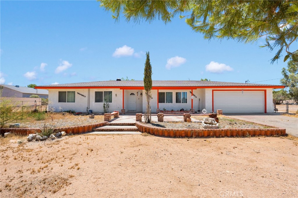 Located on ±1.37 acres, this 3-bedroom/2-bath home offers the perfect blend of style and space. Remodeled to fit modern looks, enjoy newer flooring, fixtures, and stunning bathroom and kitchen renovations. The open layout of this 1971-built home flows from a welcoming living area with fireplace into a chef-ready open kitchen—ideal for entertaining. With all bedrooms conveniently located on one level with ceiling fans, comfort meets practicality. Outside, the sprawling lot invites a variety of possibilities for outdoor recreation, hobbies, or potential equestrian use. The backyard is separated into two areas with the outer containing two sheds and makeshift chicken coop, big enough for your RV and other outdoor toys. With A-1 zoning, the City allows for a multitude of ancillary uses for agriculture and livestock. The inner backyard is designed with cement walkways, gazebo, classic brick stove, and mature landscaping. Solar is also present and ready to be assumed to save on electricity costs. Located in desirable Hesperia, this property offers rural tranquility just minutes from shopping and schools. A must-see that won't last. Reach out to the listing agent today for a showing before it's gone.