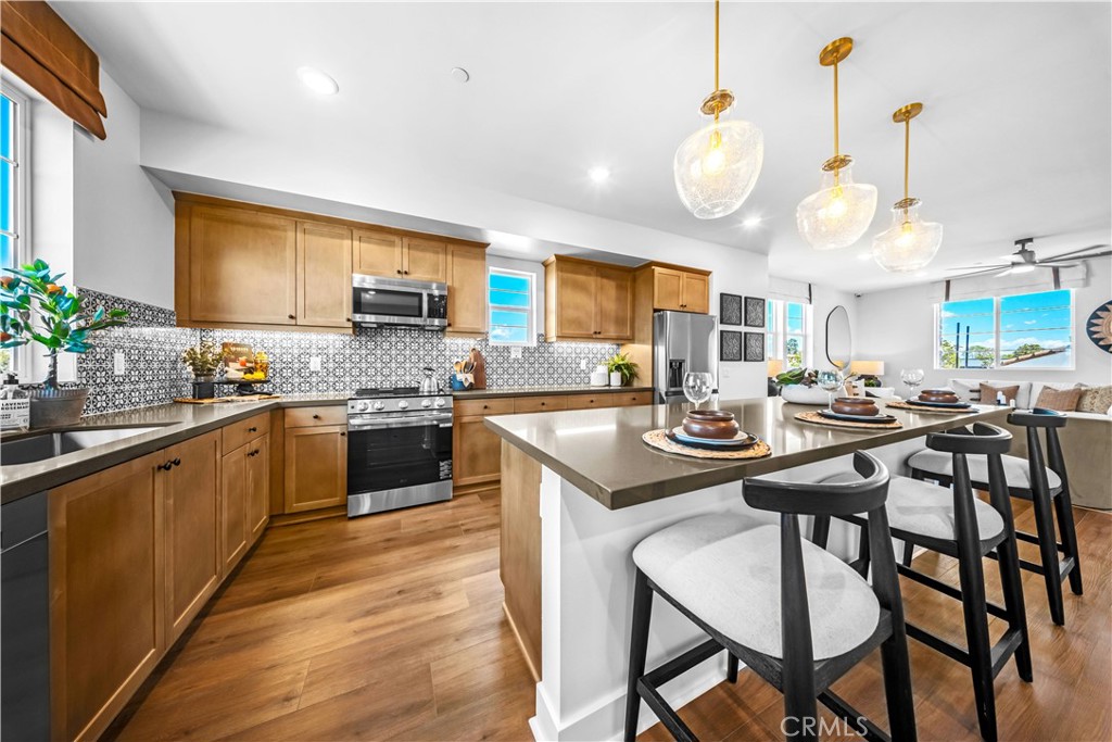 This end unit floorplan offers tons of windows which allows for more natural light. This beautiful new split-level entry townhome is situated in a prime location in the brand-new community of Palmera in Camarillo. The ground floor offers a large two car garage and a bonus room that can function as anything from a yoga studio to a game room and everything in between. The second floor offers a large kitchen with a huge island, dining area, large family room and powder room. The third floor has the primary bedroom and bathroom, two spacious secondary bedrooms and another full bathroom.
Palmera will offer a full gym, two pools, study space, a clubhouse and a dog park as onsite shopping and dining! Palmera is a new vibrant townhome community ideally located in the city of Camarillo and is just fifth teen minutes to gorgeous coastline and beaches, the legendary Camarillo Outlets, and less than a moment’s drive to the Metro Link/Amtrack station. Palmera is just a stroll to Old Town which offers great restaurants, bars, boutique shops, salons, art, and entertainment. Not to mention the farmers market every weekend. Pictures are of model home, location and finishes will vary.