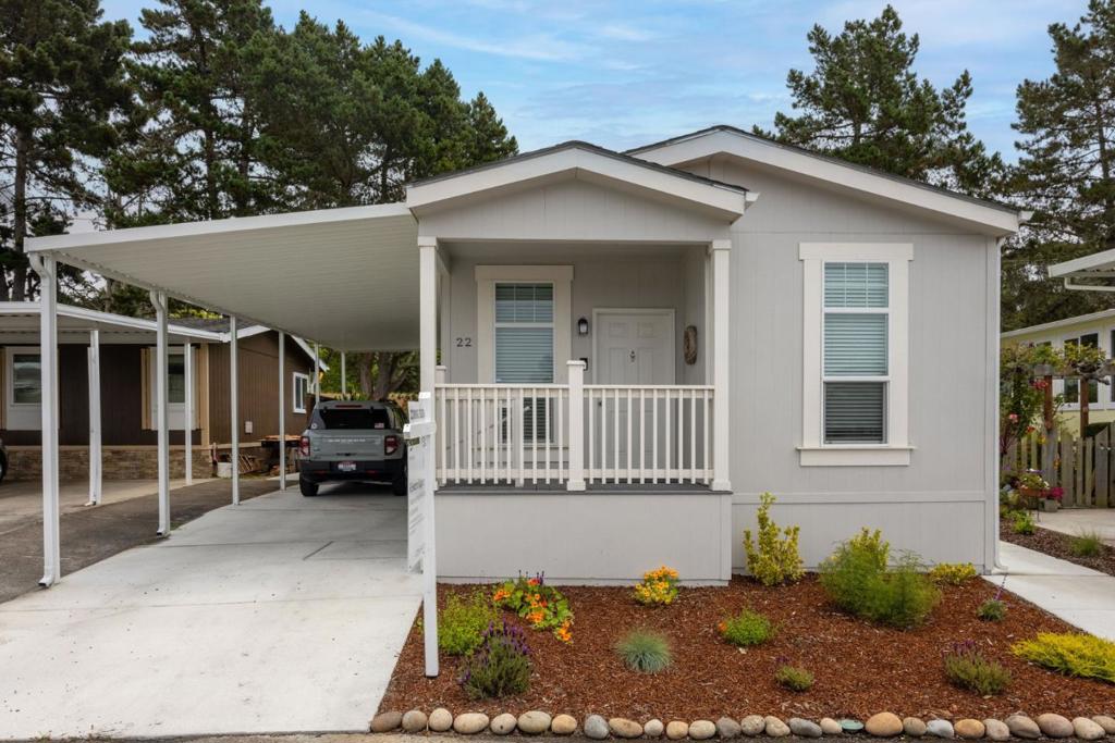 Welcome to this beautifully appointed mobile/manufactured home nestled in scenic Half Moon Bay, ready to invite you to the comfortable Canada Cove lifestyle. Step inside to discover a thoughtfully designed interior featuring three cozy bedrooms and two modern bathrooms. The heart of the home is the kitchen, which boasts a convenient breakfast bar and stainless steel appliances for your culinary creativity. The open-plan living space allows for seamless interaction, making it perfect for both relaxation and entertaining. The home's outdoor amenities provide a barbecue/patio area that invites you to enjoy alfresco dining or host gatherings with friends and family. Its an ideal spot to embrace the gentle coastal breezes. Also offered are most of the furnishings, styled for a beach house! Buy your new home fully furnished! 22 Seascape Dr offers a harmonious blend of comfort and convenience, ideal for those seeking a tranquil coastal retreat in a charming community that offers a clubhouse, pool, activities, and many amenities. Don't miss the opportunity to call this delightful property your home, where you can relish Half Moon Bay living.