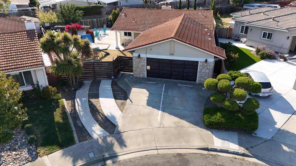 Welcome to 27941 Emerson Ave, a beautifully remodeled 3 bedroom, 2 bathroom home with a detached bonus ADU, tucked away on a quiet street with easy access to Highways 92 and 880. This property offers the perfect blend of comfort, space, and versatility. Step inside to find freshly painted interiors, fully remodeled bathrooms, and a sleek kitchen featuring stainless steel appliances, quartz countertops, and a stylish glass tile backsplash. The teak wood and tile flooring flow throughout the open-concept layout, where the kitchen, dining, and living areas blend seamlessly under soaring ceilings. The expansive backyard offers endless possibilities, whether you envision entertaining, gardening, or simply relaxing. Enjoy a large deck, built-in play structure, and generous lawn space, all set on an oversized lot that serves as a perfect blank canvas for your dream outdoor retreat. Whether you're looking for a move in ready primary residence, multigenerational living, or a savvy investment with ADU rental potential, this home checks all the boxes.