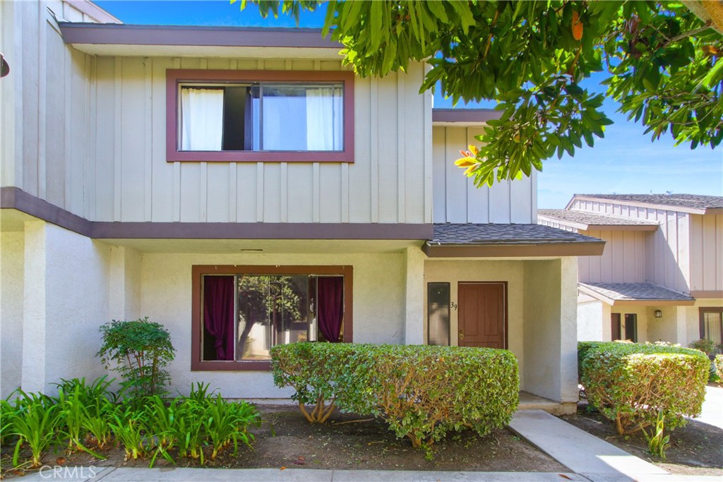 Welcome to Pepperwood Village! This spacious 3-bedroom, 3-bath townhome offers 1,446 square feet of thoughtfully designed living space — the largest floor plan available in the community. Built in 1978, this modern home features a bright and open lower level, perfect for both relaxing and entertaining. The updated kitchen boasts ample cabinet space, granite countertops, and stainless steel appliances, while tile flooring flows seamlessly throughout the main level. Upstairs, you'll find all three bedrooms, each with cozy carpeted floors, and a beautifully maintained laminate wood staircase that adds a touch of warmth and style. Additional highlights include a private patio, ideal for morning coffee or weekend gatherings, and a 2-car detached garage for your convenience. This prime location offers easy access to freeways for commuters and is within walking distance to Disneyland, shopping centers, and dining — making it a fantastic opportunity for both first-time homebuyers and investors alike. Don't miss your chance to make this wonderful home your own!
