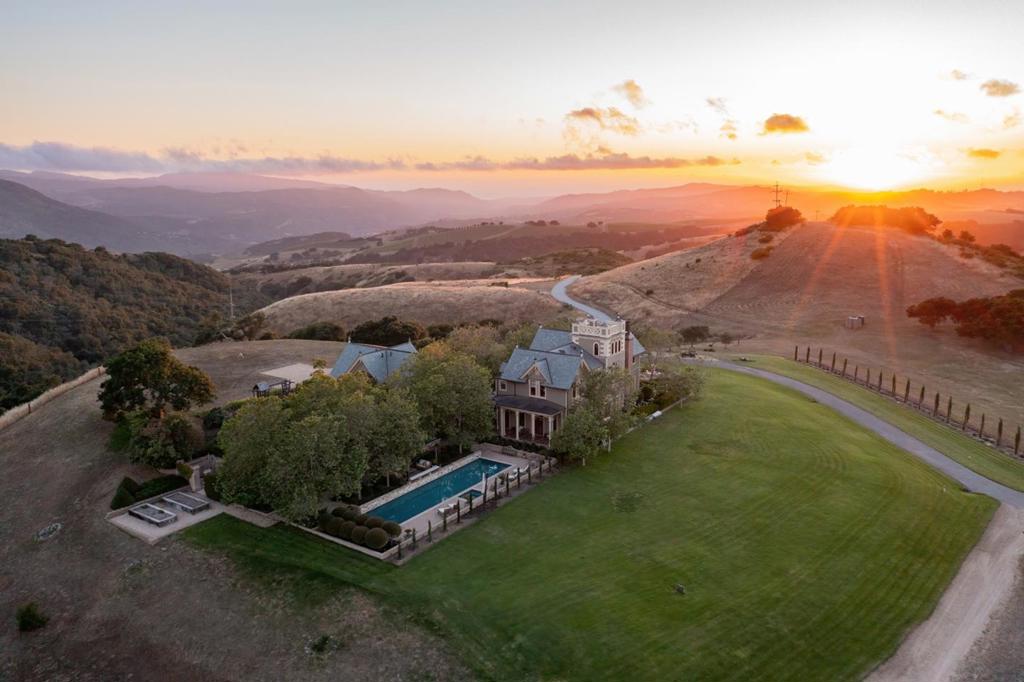 One of the most remarkable properties in Monterey County, Hinman Ranch sits high atop Laureles Grade as the Crown Jewel of Carmel Valley. A one-of-a-kind, architectural masterpiece finished in 2008, the 4,646 sqft main house is true to the Carpenter-Gothic style and presides over 265 acres of rolling hills, panoramic views, and unparalleled privacy. The ranch boasts 3 miles of private trails, a glistening lap pool and hot tub, 6 bedrooms and 5 baths in the main house, with a spacious 1 bedroom, 1 bath carriage/guest house, a 3-bay oversized garage, and 6 wells with a commercial-grade water treatment plant. No cost was spared in its construction and every detail is of the highest quality, creating a unique and peaceful escape from the hectic pace of modern life, yet with all the amenities sought in the luxury market conveniently located within minutes of Monterey Regional Airport, Pebble Beach, and Carmel-by-the-Sea.