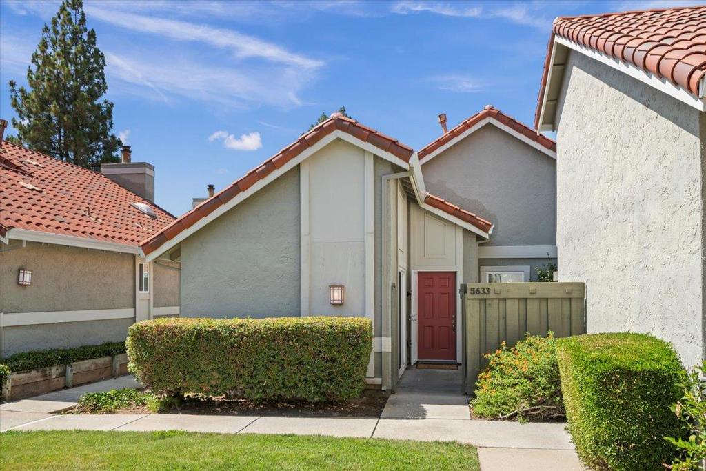 Wonderful single-level end-unit townhome in the highly sought-after Park Villas Peppertree community, esteemed for its convenient location, peaceful setting, and top-rated schools. Behind the gated entry, a charming front porch and garden area set the tone for the inviting home. Inside, the living room boasts vaulted ceilings, expansive windows and a wood-burning fireplace. The living room flows into the dining area for 4+ and the kitchen which overlooks the private back patio and boasts a pantry, white counters and cabinets, as well as direct garage access. The 3 bedrooms are each well-positioned for privacy. The front bedroom, currently used as an office, is perfect for remote work or flexible living. The second bedroom features a sliding door to the front patio and sits just past the inside laundry closet and hall bathroom with a shower-over-tub. The primary suite is complimented by generous closet space, a sliding door that opens directly to the back patio and an oversized bathroom showcasing a walk-in shower. Additional amenities: new interior paint throughout, hardwood floors, central heat, a hallway linen closet, and an attached 2-car garage with built-in cabinets. Community pool and cabana, ample guest parking, and proximity to shopping, dining, and recreation~Don't Miss!