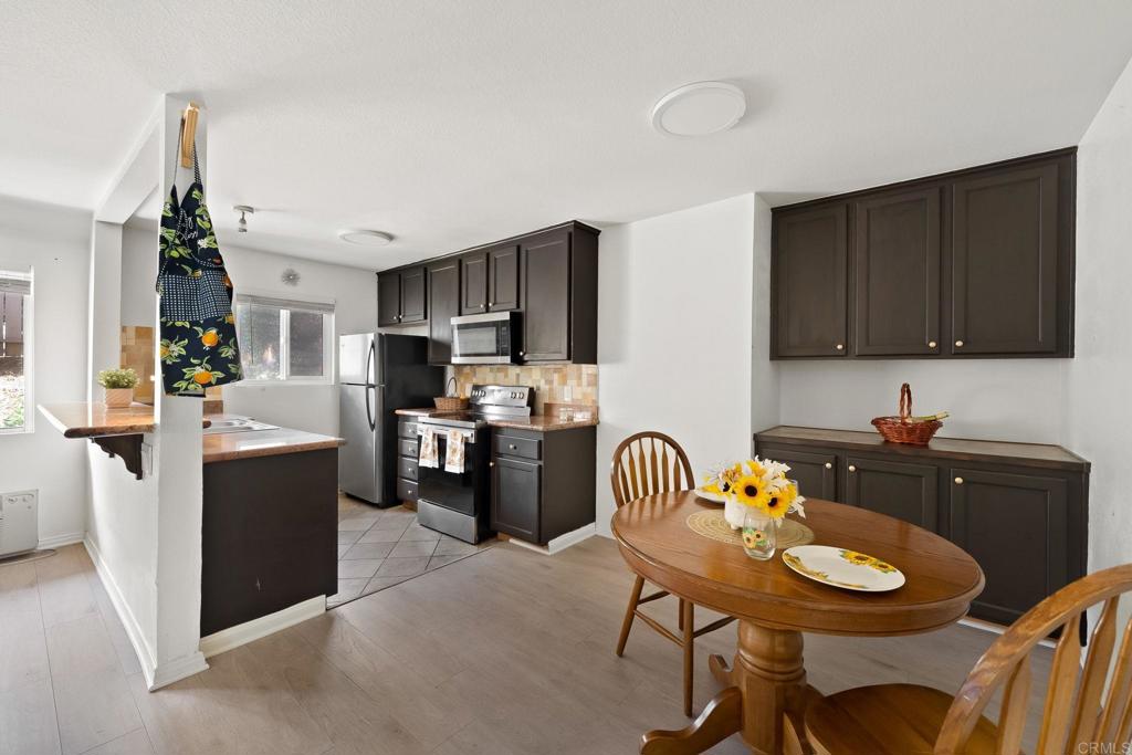 Welcome to 9860 Dale Ave #A8, a one-story, corner-unit condo tucked inside the gated Helix de Oro community in Spring Valley. From the moment you step inside, you’ll feel the comfort and warmth of a thoughtfully designed home. This 2-bedroom, 2-bathroom residence offers an airy layout with modern finishes throughout. Enjoy the spacious living area with a custom tile accent wall, and a well-appointed kitchen featuring granite countertops and stainless steel appliances, perfect for everyday living. Including the option of an additional 2nd parking spot that can be rented from the HOA. Step outside and enjoy the serenity of the community’s lush landscaping, take a dip in the sparkling pool, or relax knowing you’re in a secure complex. Conveniently located near local shops, dining, freeway access, and just a short distance from La Mesa and Downtown San Diego—this home truly has it all.