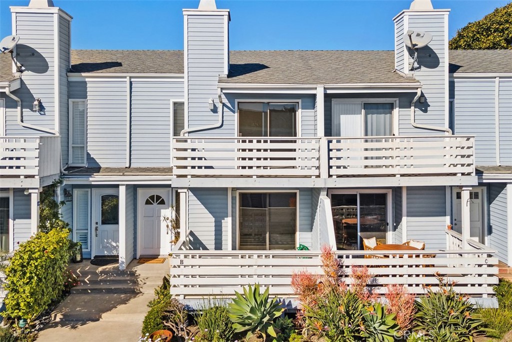 Indulge in coastal living at its finest with this stunning 2-bedroom, 1.5 bathroom townhome boasting 1,028 square feet of exquisitely designed living space. Wake up to mesmerizing ocean views from your private balcony off the primary bedroom—a serene retreat perfect for morning coffee or sunset reflections. The thoughtfully designed interior is equally impressive, featuring sleek vinyl plank flooring throughout the main level, a cozy granite-lined fireplace in the living area, and an abundance of natural light streaming in from the adjacent front patio. The kitchen showcases elegant granite countertops, a stainless steel refrigerator, a 5-burner stove and oven, and a picturesque window overlooking the private backyard oasis. The convenience of a powder room with upgraded granite countertops on the main level adds a touch of sophistication. Upstairs, the allure continues with two generously sized bedrooms, Vaulted ceilings, a beautifully upgraded bathroom, and a convenient laundry room. The primary suite offers breathtaking ocean views and a private balcony. Additional features include a one-car garage with an impressive loft area for extra storage. The exclusive community elevates your lifestyle further with resort-style amenities, including an ocean-view pool, spa, and clubhouse. Nestled in the heart of Dana Point, this prime location offers unparalleled walkability to charming downtown restaurants, boutique shops, world-class Strands Beach, and the vibrant Dana Point Harbor. This is more than a home—it’s a lifestyle. Don’t miss your opportunity to own this coastal gem.