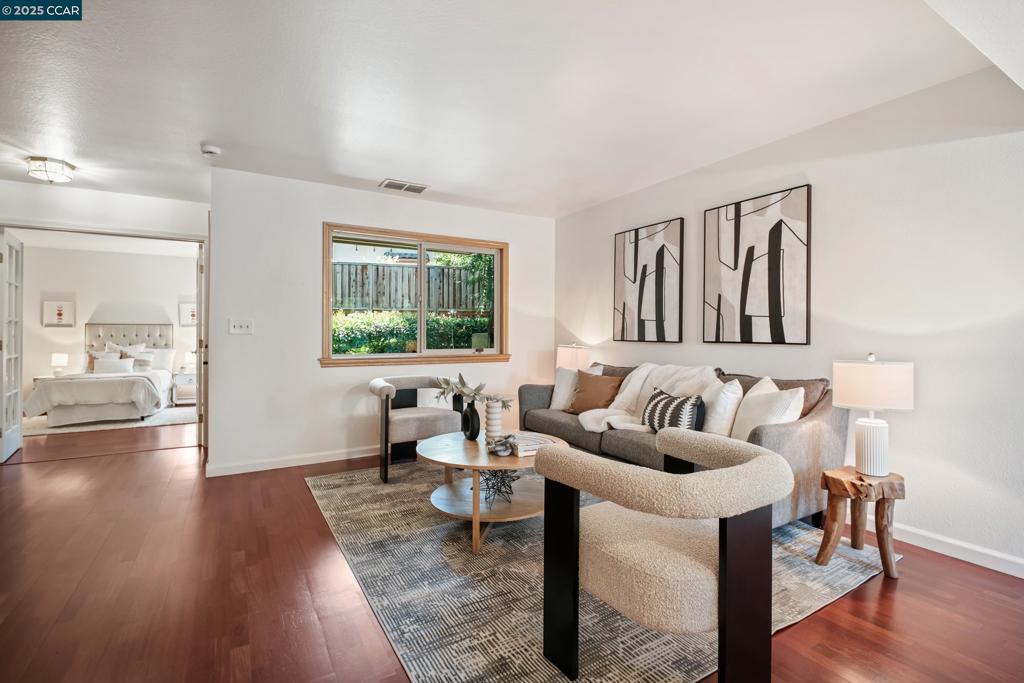 This beautifully updated 3-bedroom, 2.5-bath home offers the perfect balance of modern comfort and timeless style, all just moments from Downtown Danville. Step inside to discover an interior that feels instantly welcoming. A spacious living room to welcome guests or enjoy movie nights, a dining area to enjoy meals with loved ones, and a kitchen to hone your culinary skills all flow seamlessly together. The thoughtfully designed kitchen offers ample cabinetry, quartz counters, and peaceful views of the community pool. Through glass-paned French doors, the flexible floor plan includes a versatile third bedroom on the first floor that easily doubles as a home office, guest retreat, or creative studio—tailored to fit your lifestyle. Upstairs, the spacious primary suite features vaulted ceilings, a generous walk-in closet, and a serene en-suite bath with an oversized quartz vanity with shaker cabinets. Enjoy the private balcony—a tranquil escape for morning coffee or an evening tea. Take a stroll to downtown, where you’ll find boutique shopping, top-rated restaurants, cozy cafés, and local events that give this community its beloved small-town charm. Located in the award-winning SRVUSD, this home is ready for you to host friends, relax poolside, or simply unwind from your busy day.