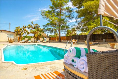 Photo of 7737 Aster Avenue, Yucca Valley, CA 92284 (MLS # JT26053412)