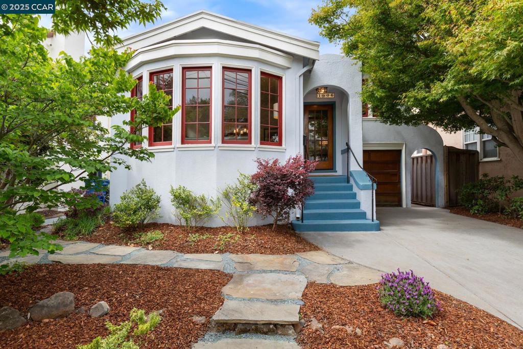 Timeless character meets walkable convenience in this beautifully preserved 1924 craftsman home. Ideally located on one of Alameda’s rare closed thru streets, that is peaceful and private. Step inside to gleaming original hardwood floors, rich in warmth and detail. The inviting formal living room features a classic wood-burning fireplace, surrounded by built-in cabinetry and wood-framed windows that flood the space with natural light. Entertain in style in the formal dining room, accented with original moldings and built-ins, offering a perfect blend of charm and function. The layout flows seamlessly into a thoughtfully designed kitchen with breakfast nook & garden window. This home showcases the craftsmanship of its era, with built-in shelving, solid wood doors and period trim work throughout. Each detail speaks to the pride of ownership and quality rarely found in newer homes. Enjoy the calm and community feel where neighbors stroll and traffic stays away, yet you're just minutes from Park Street dining, coffee shops, local markets and the shoreline. Outside, the backyard is a hidden gem, ideal for outdoor dining, gardening, or relaxing under the trees. Step down into a surprisingly expansive basement-level garage with an extended depth that runs the length of the home.