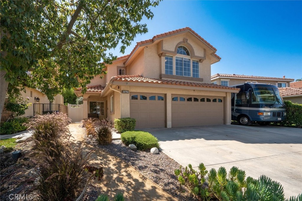 NO Mello Roos! NO HOA! This Stunning Sunrise Ridge Home in Bouquet Canyon. Welcome to this beautifully updated Coronado Model with 5 bedrooms, 3 full bathrooms, and an Entertainer’s Dream Backyard. This home is the perfect blend of style, comfort, and functionality. Step into the Entry Foyer where Soaring Two-Story Ceilings and Expansive Windows flood the Formal Living and Dining Rooms with Natural Light, creating a Bright and Welcoming ambiance. The Interior has been freshly painted, offering a pristine, move-in-ready canvas for your personal style. New Vinyl Wood Flooring Downstairs and new Carpeting Upstairs bring warmth and modern appeal throughout. Downstairs, a private Bedroom with adjacent Full Bath are ideal for Guests or Multi-generational Living. The spacious Laundry Room with Sink and Cabinetry is conveniently located just in from the 3-car Garage.
The Family Room, featuring a cozy Fireplace, opens to the Updated Kitchen with Quartz Countertops, Stainless Steel Appliances, and a Hydrotech Reverse Osmosis System with dedicated Tap. This Open-Concept Space is perfect for daily living and entertaining. Upstairs, you'll find four more generously sized bedrooms, including the Luxurious Primary Suite with Two Walk-In Closets, Luxury Bathroom recently remodeled with Dual Vanities, a separate Soaking Tub, Large Walk-In Shower with Multiple Shower Heads, and a private WC. One of the secondary Bedrooms is large enough to serve as a Second Master, or an Office, a Gym, or Recreation Room. The upstairs hall Full Bathroom serves the additional bedrooms. From the Family Room, step outside through the Glass-Panel door with Sliding Screen and discover your Private Backyard Oasis—complete with Pebble Tec Pool and Spa, a Large Built-in Fire Pit, and ample Patio Space and Decking to host anything from intimate evenings to full-scale parties with enough room for a band setup!
Additional features include: 55’ x 13’ RV Parking area—large enough for a Full-size RV and a Boat * Dog Area outside with Doggie Door from Family Room * Whole House Water Purification System * Built-in Central Vacuum System * Owned Solar System with Level 2 EVSE Charging for Electric Cars *
Security System with 4 Cameras and a Swan 8-channel DVR * Front Rain Gutters
This home has everything you’ve been searching for—space, updates, and features galore—all in one of the most sought-after SCV Communities. Don’t miss this rare opportunity to own a Turnkey property with Unmatched Amenities!