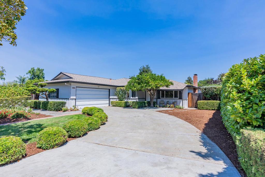 Perfectly situated in a peaceful neighborhood on the border of Cupertino and Los Altos, this newly updated gem is just a short stroll to Top-Rated Cupertino schools, De Anza and Homestead Crossing Shopping Center and moments from parks and trails. Rich hardwood floors lead into a bright, sun-filled living room with recessed lighting, dual-pane windows and cozy fireplace. Folding louvered doors open past the dining room into the kitchen/family room combo, complete with an additional dining area. The kitchen showcases high-end stainless steel appliances, granite countertops, vast cabinetry and a skylight. All bedrooms are spacious with their own closets, while the primary suite offers dual closets, newly updated en-suite bathroom and bonus office/den. Additional highlights include a two-car garage with washer, dryer and sink, plus a beautifully landscaped backyard with a pergola with built-in seating, planter boxes and an impressive variety of fruit trees, orange, persimmon, fig and guava. In spring, a pavilion draped in blooming wisteria adds charm, while a shed provides convenience. Ideally located near top Silicon Valley tech hubs, Apple, Google and Meta, with easy access to highways 85, 280 and Caltrain. Do not miss your chance to own this ideally located gem. It will go FAST!