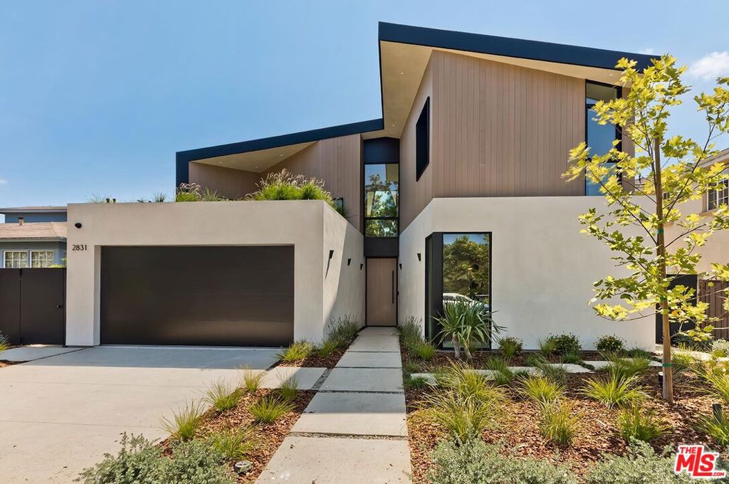 A contemporary, brand-new built home in Rancho Park designed by acclaimed Desai Architects and built by Gaia Construction, this 4 bedroom/5 bath Modern style masterpiece is truly stunning. Step inside and be transported to a sophisticated Italian villa: muted tones, broad tile flooring, soaring ceilings, the massive sliding glass doors allow the entire home to be basked in natural light, creating an airy, open flow throughout the interior. An oversized island subtly separates the sleek chef's kitchen from the rest of the social rooms of the first floor making the the entire space ideal for entertaining. The kitchen is enhanced by its design aesthetic; gone are bulky, unnecessary fixtures and instead you'll find smooth surfaces on the imported Italian cabinetry and high-end Miele appliances that disappear into the background. From every angle is a lovely view of the backyard that feels like an extension of the home: wholly secluded and surrounded by greenery, the yard offers a flat expanse of grass, pool, hot tub, built-in bbq in the al fresco kitchen. Upstairs are the family's living quarters, the Primary Suite providing high ceilings, enormous walk-in closet and beautiful bathroom with luxurious tub. Additional features of this 3450 sq ft home include: upstairs laundry facility, living roof garden, owned solar panels, 6-unit AC so each room can control its temperature, fireplace, Control-4 smart home automation and two car garage. Conveniently located near the shops and businesses on Pico and Expo line yet situated on a quiet, friendly street full of many happy families in the highly coveted Overland School District, this new home is a neighborhood star!