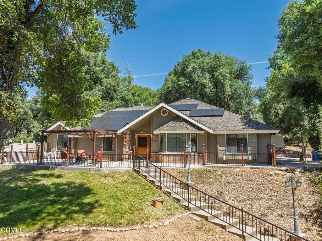 Spectacular Oakhurst Estate on Over Two Acres, Ideal for Homeowners, Investors & Vacation Rental Income! Just three miles from iconic Bass Lake and a short drive to Yosemite National Park, this exceptional custom built single-story, 2,800 sq ft residence on over two acres offers the perfect blend of comfort, versatility, and long-term value, ideal as a primary home, multi-generational retreat, or full-time vacation rental investment.This meticulously maintained home features four spacious bedrooms and three full bathrooms, including two master suites, one of which can be easily separated into a private guest quarters or income-generating rental unit.Inside, enjoy a fully updated kitchen with Cambria quartz countertops, custom cabinetry, and modern appliances, complemented by engineered hardwood floors.Outdoor living is front and center with a chemical-free ozone swimming pool, multiple patios, fruit trees, built-in BBQ. The paid-in-full solar system and private well add ongoing savings and self-sufficiencyFor added functionality, the property includes a detached workshop with a paint booth and two levels of loft storage, covered RV parking with full hookups including sewer disposal and a extra storage shed for tools or toysThis fully furnished property is turn-key for short-term vacation rentals, full time living and affordable to operate thanks to the solar and well water, with outdoor amenities that make it a destination in itself!Whether you're looking to live, host, or invest, this Oakhurst gem checks every box.