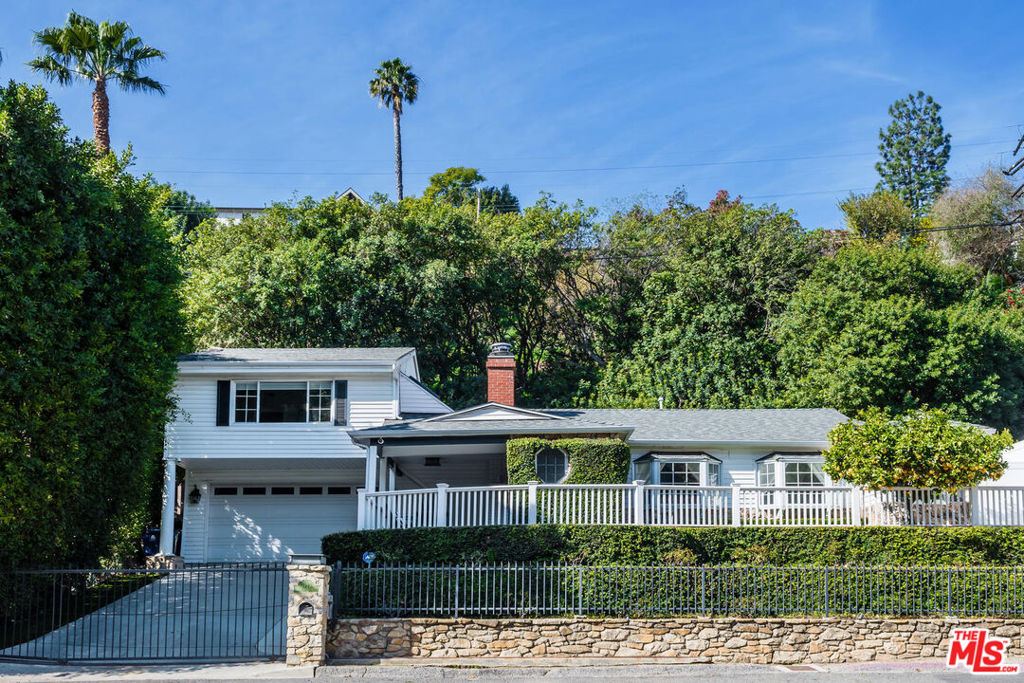 This is a beautifully furnished and gated pool home that also serves as a tranquil retreat, nestled in the hills in Sherman Oaks bordering Beverly Hills. Featuring 3 spacious bedrooms, 2 sparkling bathrooms, the property features nature views from every window. The home boasts neutral color tones, hardwood floors, an open kitchen with subway tile, quartz counter-tops, Viking Appliances, marble bathrooms, and heated pool! The master bedroom is secluded upstairs with vaulted ceilings and black out window coverings and a luxurious bathroom and walk in closet. This home has it all. Located behind gates on a quiet street.
