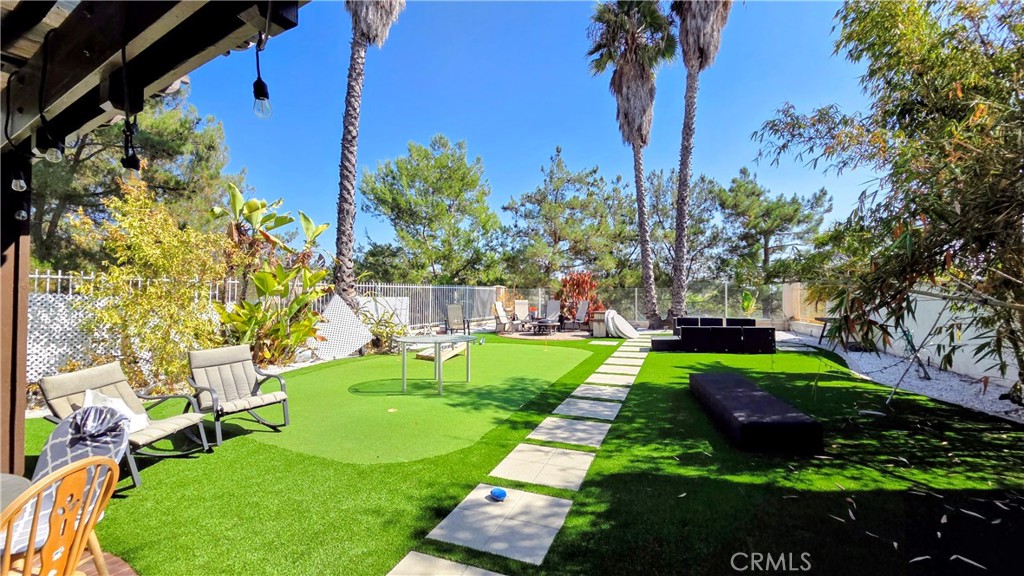 You found a true diamond in the rough - 10 Verano, a spacious 4-bedroom, 2.5-bath home offering 2,036 square feet of living space on a rare 8,000-square-foot lot - one of the largest in the community! While the home needs updating and repairs, it’s priced accordingly, offering exceptional potential for those ready to add value through renovation, allowing one to make this home theirs!
With its generous lot, great floor plan, and prime location near the Foothill Ranch Towne Centre, Center South, and The Village—the premier retail hubs in the area featuring 80+ shops, restaurants, and cafés offering everything from quick bites to fine dining and desserts—you’ll love having so much just minutes away. Plus, 10 Verano is located within the highly rated Saddleback Valley Unified School District.
Inside, you’ll find a bright living room with soaring vaulted ceilings, a comfortable family room with a cozy fireplace, and a spacious kitchen with room for casual dining. A formal dining area makes entertaining easy. All four bedrooms are located upstairs, including a primary suite with a private bath and generous closet space. A convenient half bath is located downstairs for guests.
Step outside and enjoy beautiful mountain, city-light, and even Catalina Island views from the large backyard — an incredible setting for gatherings, gardening, or simply relaxing under the stars.
Community amenities include multiple parks, pool and spa, clubhouse, tennis and sports courts, and hiking/biking trails connecting to the scenic Whiting Ranch Wilderness Park.
10 Verano represents a rare opportunity to invest in space, views, and value. Sellers request no assignments and no blind offers.