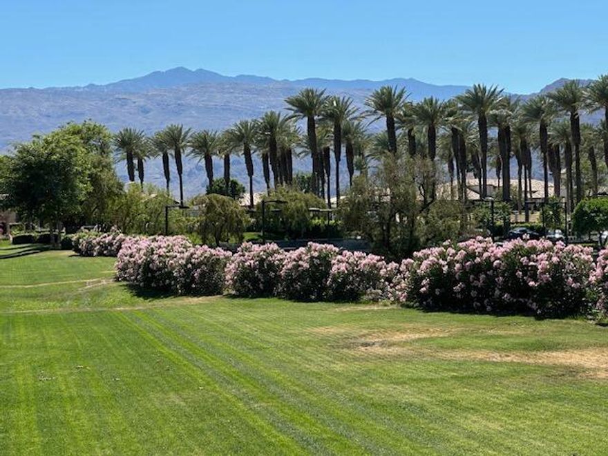 Experience the essence of desert luxury in this beautifully remodeled Casita, perfectly positioned along a wide greenbelt with panoramic views of the majestic Santa Rosa Mountains. Framed by lush palm and citrus trees, this serene retreat captures the beauty of the desert at every turn--whether you're enjoying your morning coffee or evening cocktails, the views and ambiance are simply unforgettable. This is one of the few Casitas that boasts its own private spa two steps away from the primary bedroom suite.  The open great room floor plan is light and inviting, featuring tall ceilings, expansive windows, and a seamless indoor-outdoor flow that takes full advantage of the mountain vistas. The interior has been thoughtfully remodeled from top to bottom, with attention to detail in every space. Elegant wood-look ceramic tile flooring flows throughout, complemented by fresh interior paint, new shutters and blinds, and hand-painted millwork and furniture that enhance the home's warm, modern style. The living area centers around a redesigned fireplace with new surround and mantle, adding a sophisticated focal point for cozy evenings. The remodeled kitchen shines with quartz countertops, refinished cabinetry, stainless steel appliances, new sink and disposal, and a chic chandelier above the dining area. A designer ceiling fan adds flair and comfort to the great room. The spacious primary suite offers tranquil privacy with a private spa just outside the bedroom, plus a large bathroom with dual sinks, soaking tub, oversized shower, and a walk-in closet with built-in organizers. Two inviting guest bedrooms share a remodeled adjoining bath, and there's an updated powder room with a new sink. Additional upgrades include: two new air conditioners (home and garage), garage epoxy flooring, new TVs, new area rugs and furnishings (per Inventory List), and a Water Cop leak protection system that connects to your phone for peace of mind. An electronically operated patio awning provides instant shade when you want it, making outdoor living effortless. This exceptional Casita combines elegance, comfort, and smart technology--offering a perfect blend of modern convenience and timeless desert charm.