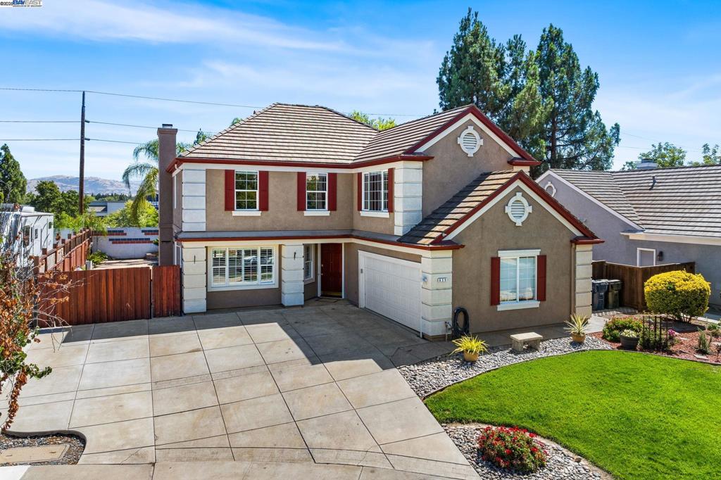 Stunning two-story Pulte Estate Home in Livermore! 5 bedrooms, 2.5 bathrooms, and 2,483 sq ft of beautifully designed living space. Step inside to soaring ceilings, custom shutters, and timeless details including wainscoting and crown molding. The home features two spacious living areas—one with an open-concept layout that flows seamlessly into the kitchen, complete with a cozy fireplace, ornate mantel, custom wall paneling, and oversized ceiling fan. The chef’s kitchen boasts a large island, stainless steel appliances, solid wood cabinetry, and stone countertops. Retreat to the luxurious main suite with vaulted ceilings, abundant natural light, deep soaking tub, shower stall, double vanity, and private water closet. Perfect for entertaining, the backyard is an oasis with a covered patio and fan, sparkling in-ground pool with fountains, mature shade tree, side yard access, and an oversized storage shed! A rare find that combines elegance, comfort, and outdoor living at its best! Owned Solar!! Huge side yard access gate and driveway!!!