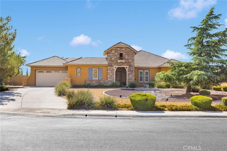 **Welcome to Your Dream Home in the Prestigious Gated Community of Ravenswood, Apple Valley!**



Situated in the heart of Apple Valley, this elegant 5-bedroom, 3.5-bathroom home offers 2,966 sq ft of thoughtfully designed living space on an expansive 18,293 sq ft lot. Built in 2008 and located in one of the most desirable gated communities, this property offers the perfect blend of luxury, function, and tranquility.



Step into the **grand entryway with soaring high ceilings** that create an immediate sense of openness and sophistication. The spacious interior includes a **large living room with a cozy fireplace**, a **formal dining or living area**, and a **versatile bonus room** that can easily serve as a **6th bedroom, home office, or playroom**.



The heart of the home is the gourmet kitchen, featuring a **massive granite island**, **dual sinks**, **double oven**, **walk-in pantry**, **butler’s pantry**, and **abundant cabinet space**—ideal for both everyday living and entertaining. Enjoy effortless flow to the outdoors through **grand French doors** that open from the kitchen, formal living room, and main bedroom to the beautifully landscaped backyard.



The **luxurious primary suite** offers ample space and privacy, with direct backyard access, a **spa-like ensuite bathroom** featuring **dual sinks**, a **soaking tub**, walk-in shower, and **his and hers walk-in closets**.



At the heart of the home, a **private courtyard** with a **low-maintenance koi pond** provides a peaceful, Zen-like retreat. The separate **casita** with its own entrance, full bath, and closet is perfect for guests, multi-generational living, or a private workspace.



Additional features include:



* **Dedicated laundry room** with large sink and cabinet storage

* **Newer tankless water heater**

* **Well-maintained backyard with mature landscaping**

* **Gated HOA with controlled access** for added security and peace of mind



Located just minutes from **top-rated schools**, shopping, restaurants, theaters, and the growing town center, this meticulously maintained home offers the perfect combination of comfort, elegance, and convenience.



**Don’t miss this rare opportunity to own a standout home in the coveted Ravenswood community—schedule your private showing today!**