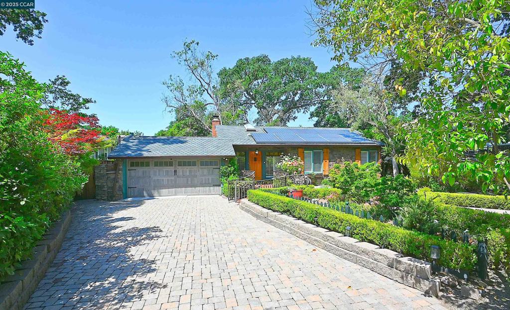 Super cute single-story cottage on the Walnut Creek and Poet’s Corner border. Renovated home boasts a chefs’ kitchen with a large island, 2 sinks, updated cabinets and walk in pantry. Private primary bedroom with French doors that lead to backyard, a fireplace and huge primary bathroom with impressive walk-in shower, double sinks and water closet. Hall bathroom is updated with newer tub, and gorgeous tile. Family room with tile floors and Anderson French doors lead to a lovely fairy book backyard with a bonus building with power, lighting and fan (office?). The backyard is landscaped with a drip system, new back fence, and has beautiful pavers. The home has 2 fireplaces (living room has been rebuilt) and a remote-controlled fireplace in the primary suite. It has new shutters, new texture and paint. New irrigation system and gas shut off in front yard. New gutters. Must see!! This home is a walkers’ dream as it is literally across from the CC trails and close to restaurants, coffee shops and grocery store. Minutes to 680, 24 and BART. **Now offering closing cost credit or rate buydown**